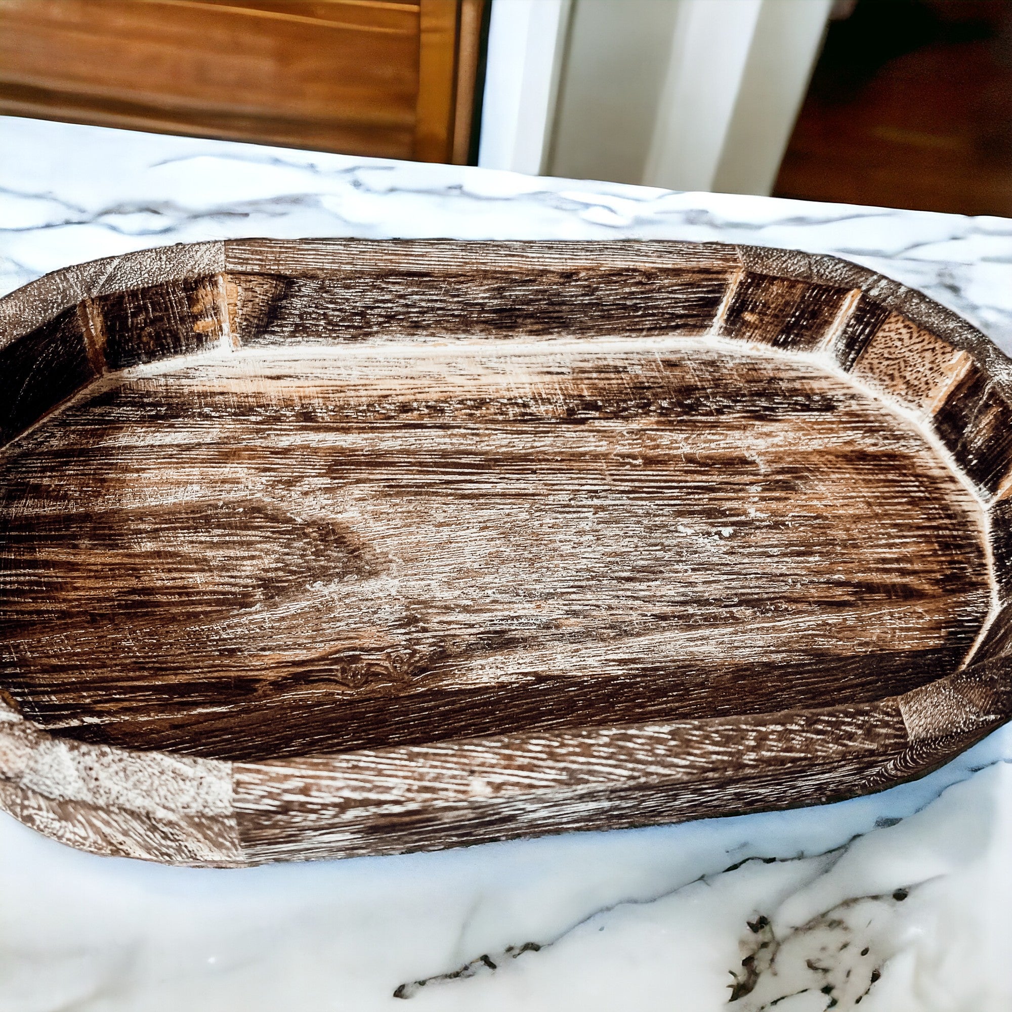 A rustic wood tray made from Paulownia wood, featuring white distressed details, ideal for home decor and organization.