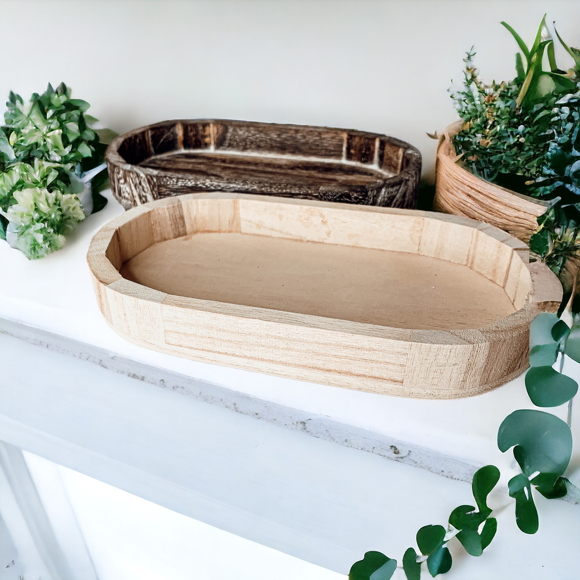 A rustic wood tray made from Paulownia wood, featuring white distressed details, ideal for home decor and organization.