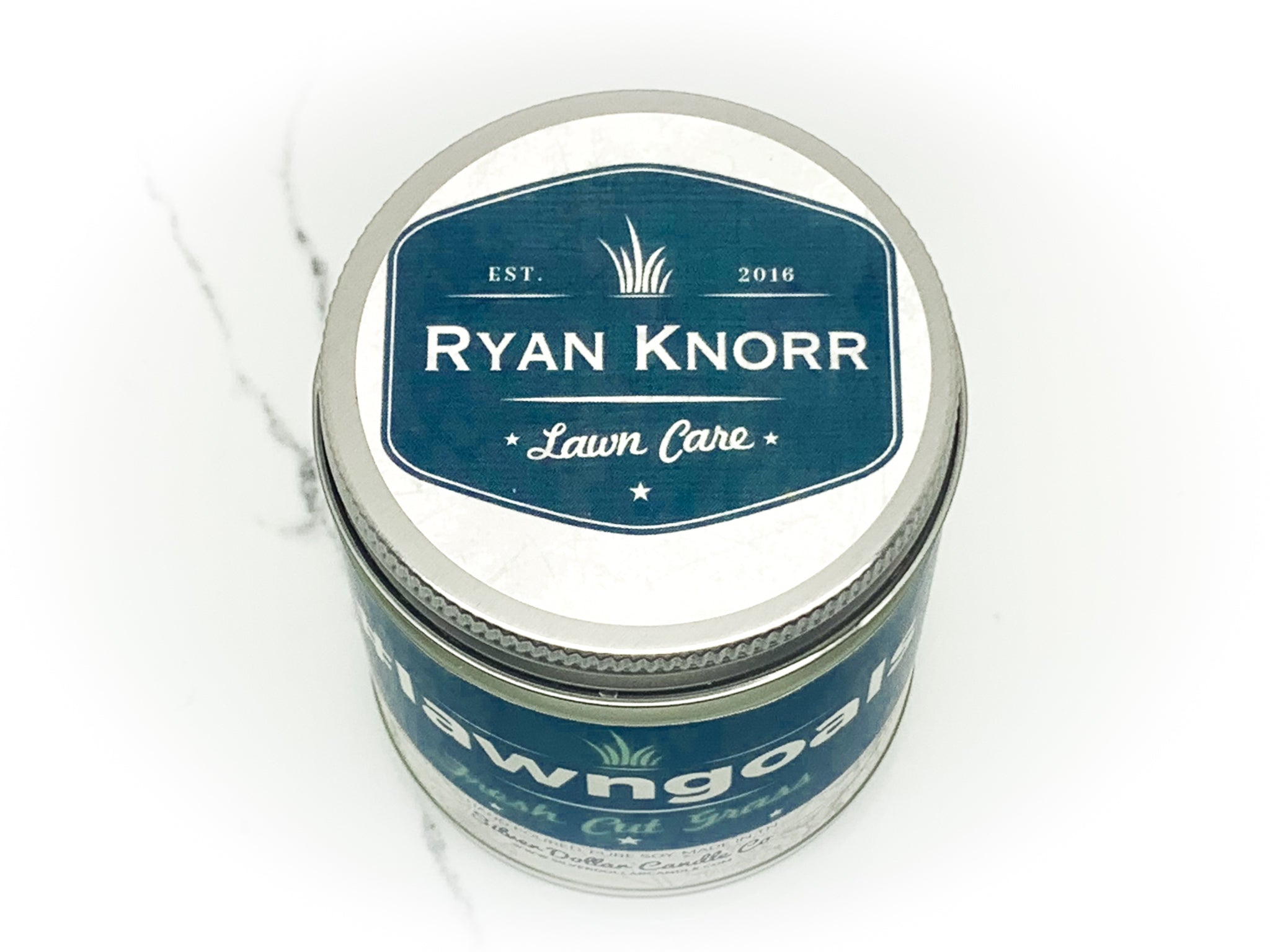 Ryan Knorr #LawnGoals candle with Fresh Cut Grass fragrance, hand-poured in Tennessee, showcasing a clean and elegant design.