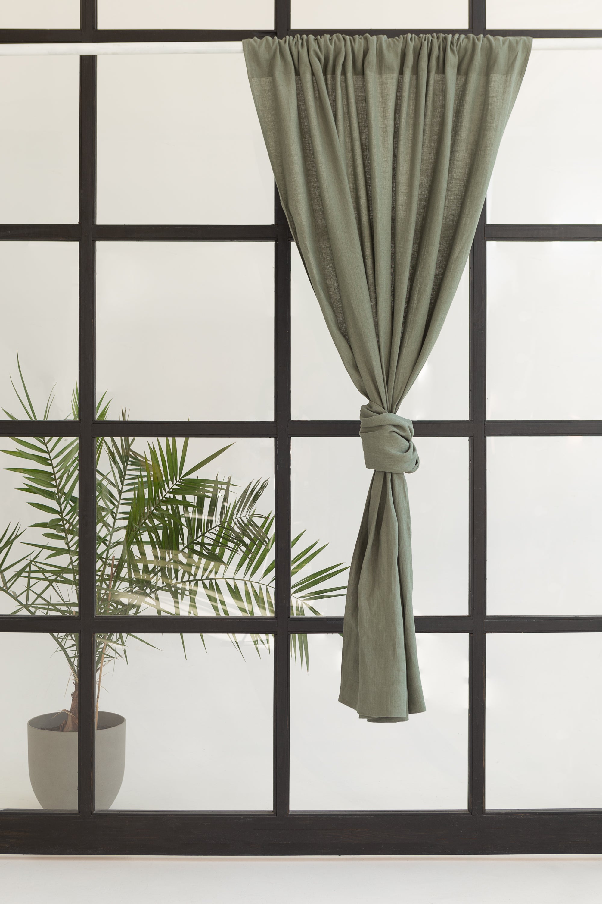 Safari Green linen curtain with rod pocket, showcasing its semi-sheer texture and elegant design.