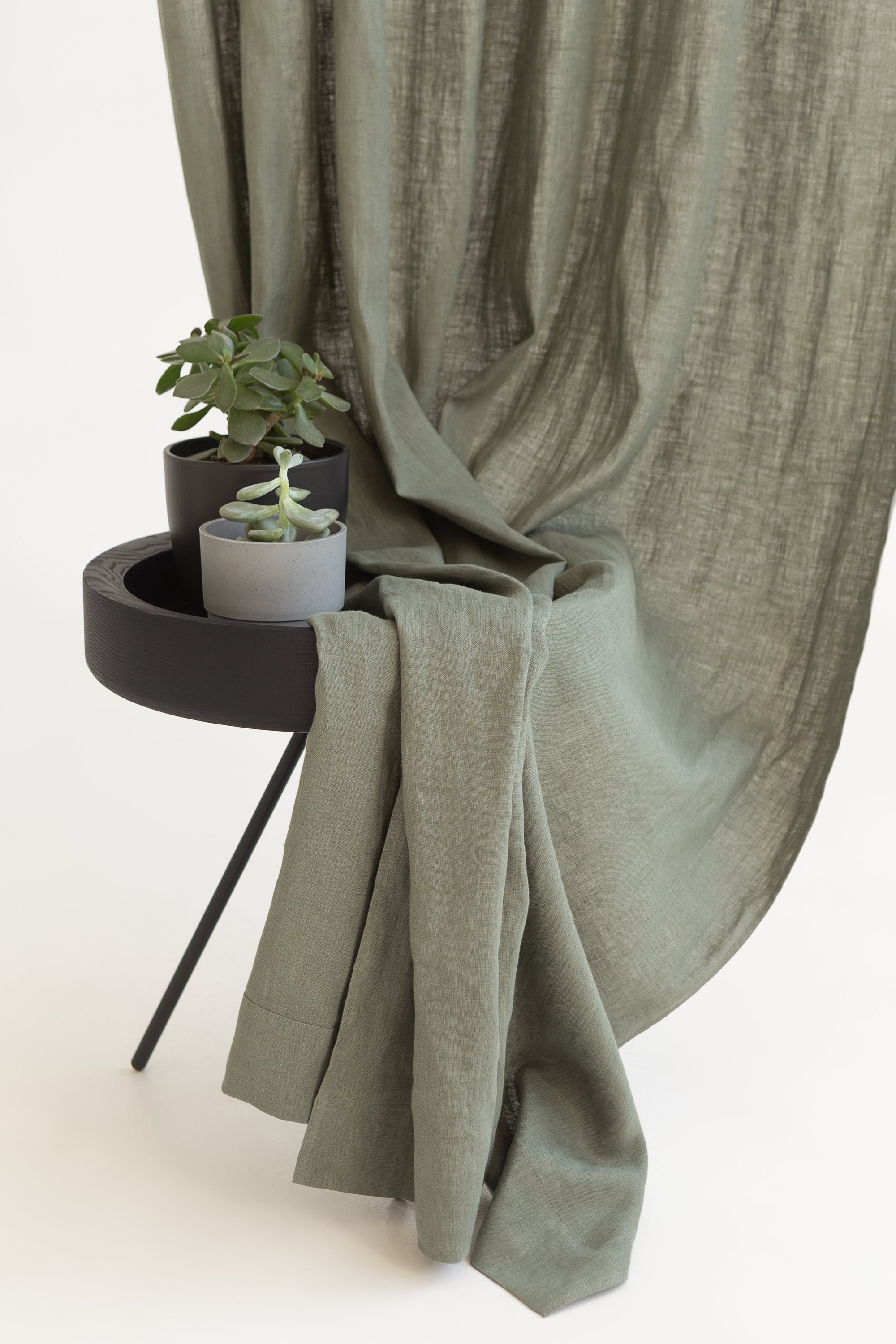 Safari Green linen curtain with rod pocket, showcasing its semi-sheer texture and elegant design.