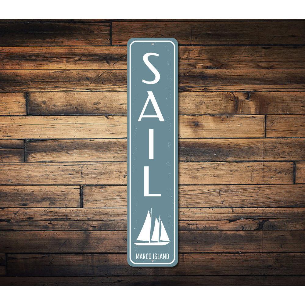 Sail Vertical Sign featuring beach-themed design, made from high-quality aluminum, ideal for coastal decor.