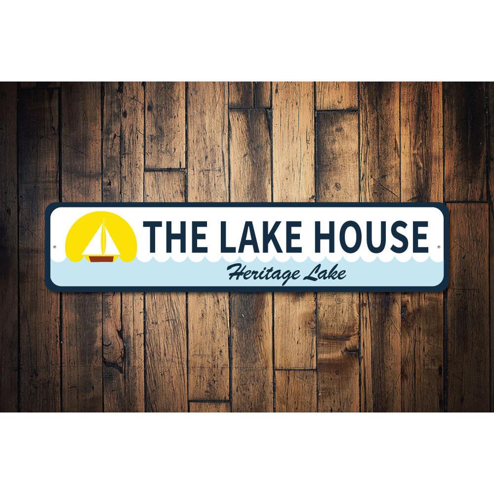 A beautifully crafted Sailboat Lake House Sign made from durable aluminum, featuring a sailboat design, perfect for lake house decor.