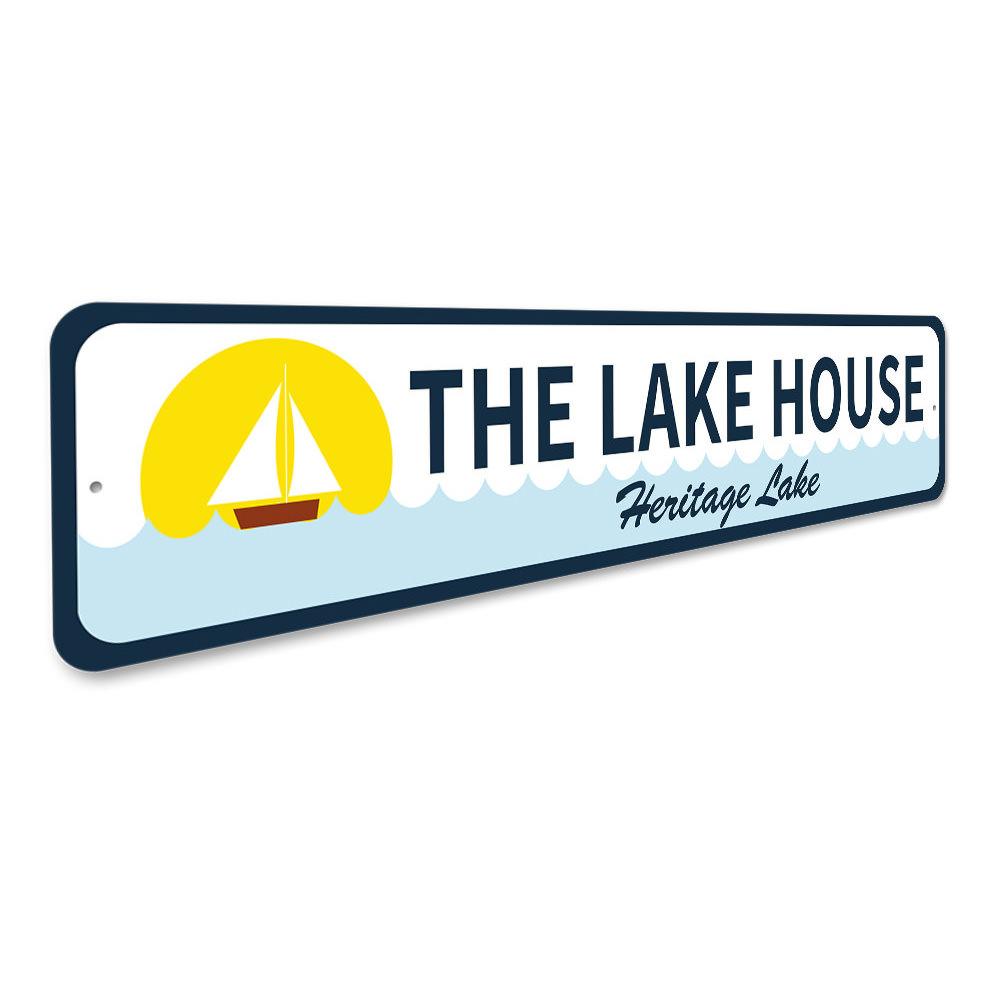 A beautifully crafted Sailboat Lake House Sign made from durable aluminum, featuring a sailboat design, perfect for lake house decor.