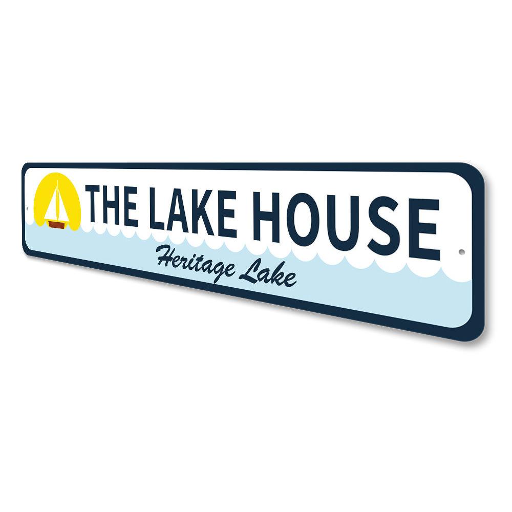 A beautifully crafted Sailboat Lake House Sign made from durable aluminum, featuring a sailboat design, perfect for lake house decor.