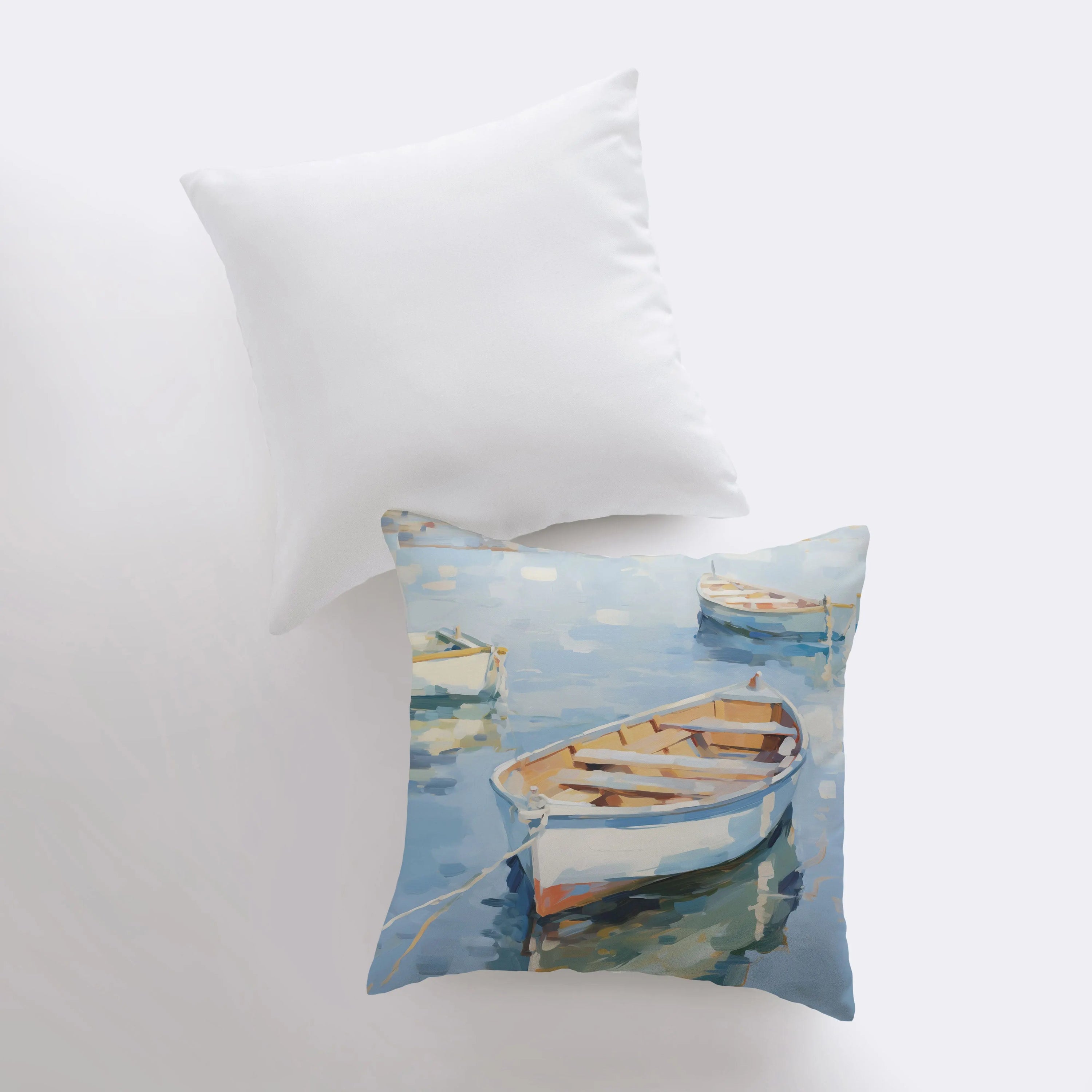 A beautifully crafted throw pillow featuring a sailboat on blue water, perfect for coastal decor.