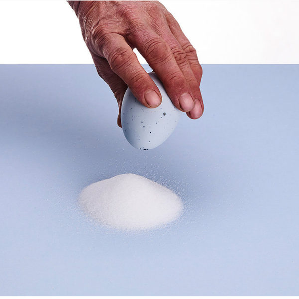 El Salt Shaker by DE INTUITIEFABRIEK, egg-shaped porcelain and cork design in multiple colors.