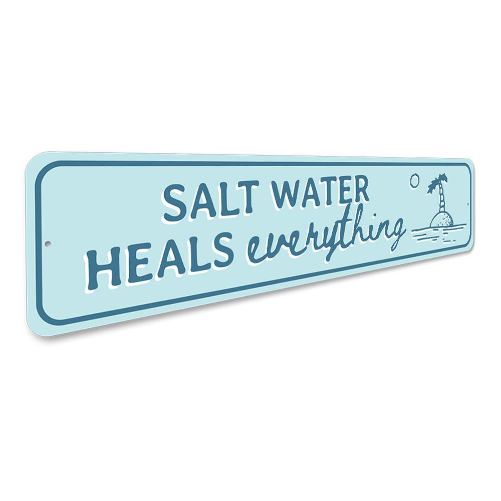 Saltwater Heals Sign made of high-quality aluminum, featuring a beach-themed design perfect for coastal decor.