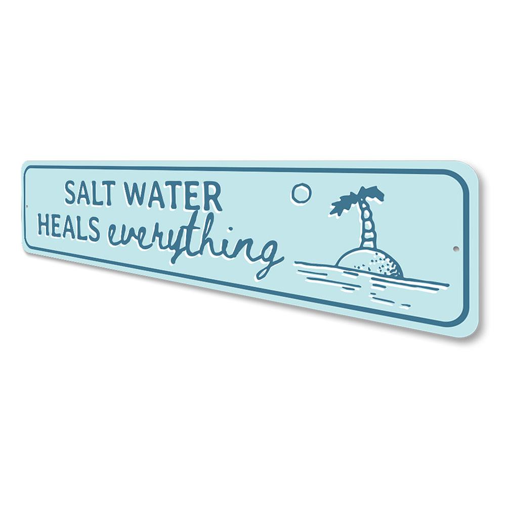 Saltwater Heals Sign made of high-quality aluminum, featuring a beach-themed design perfect for coastal decor.