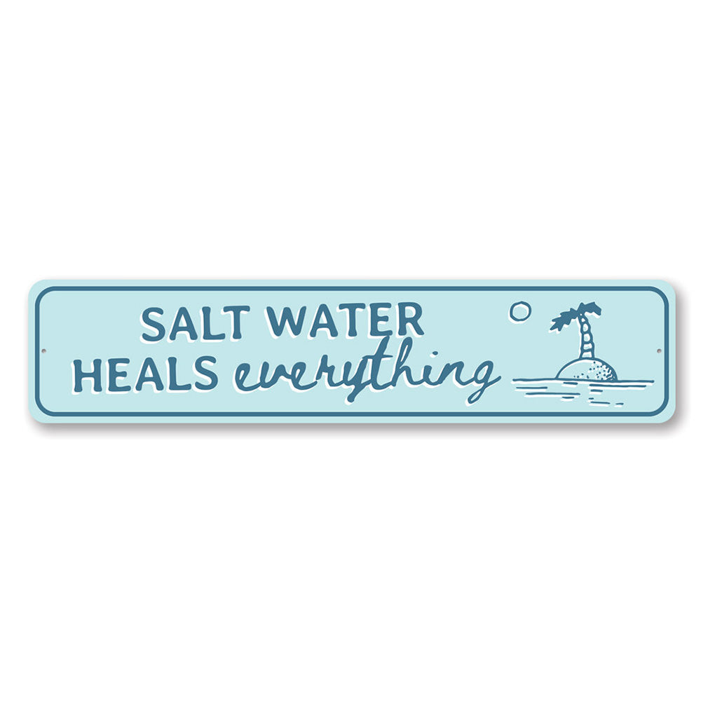 Saltwater Heals Sign made of high-quality aluminum, featuring a beach-themed design perfect for coastal decor.