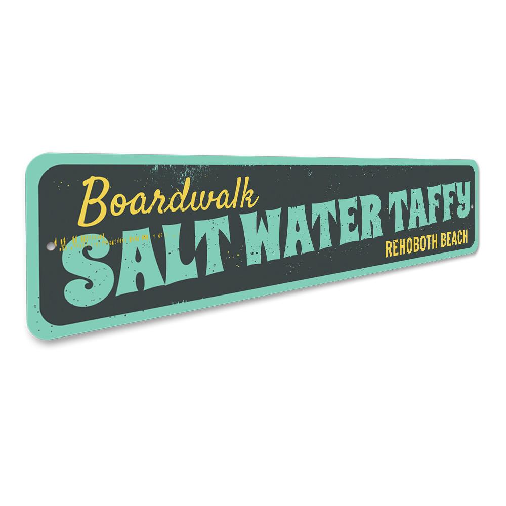 A colorful Saltwater Taffy Sign made of durable aluminum, featuring beach-themed graphics and customizable text options.