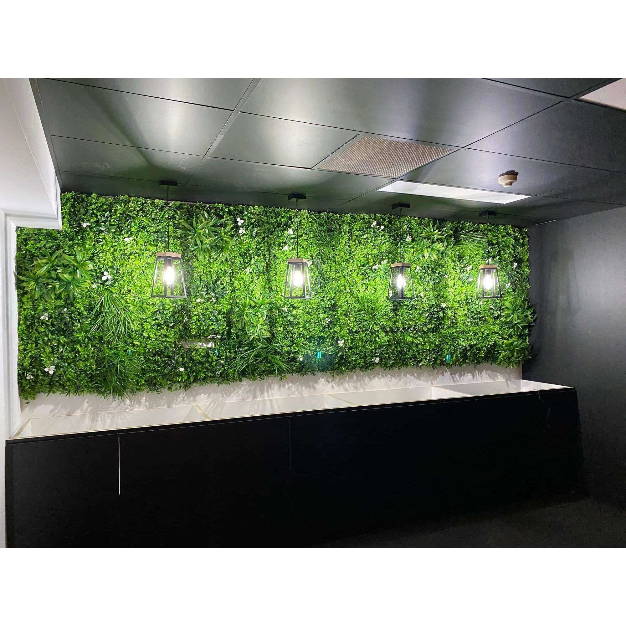 Sample of White Lily Artificial Vertical Garden Panel featuring white flowers and green foliage, perfect for wall decoration.