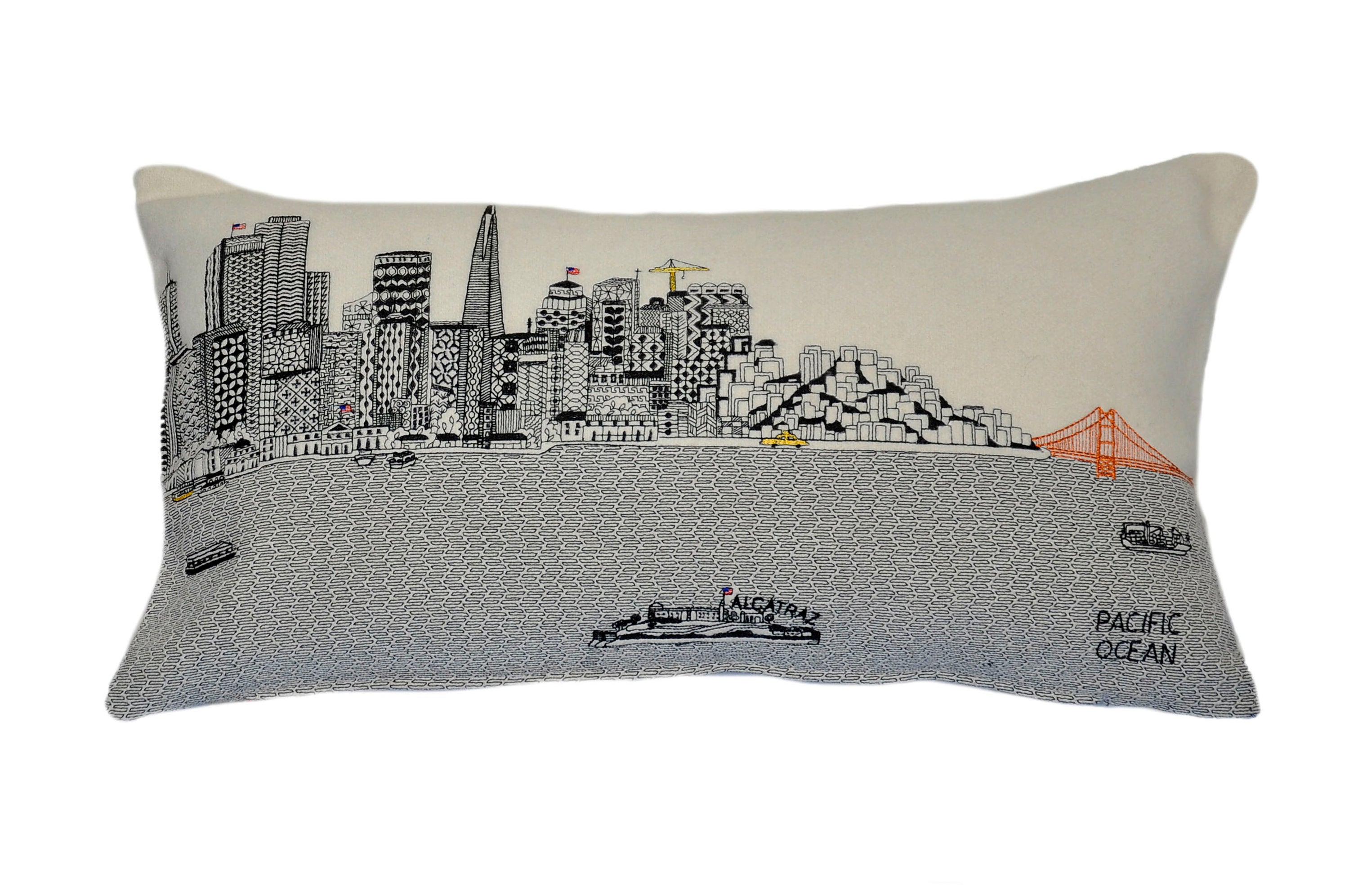 San Francisco Pillow featuring embroidered landmarks like the Golden Gate Bridge and Alcatraz Island, with a red zipper at the bottom.