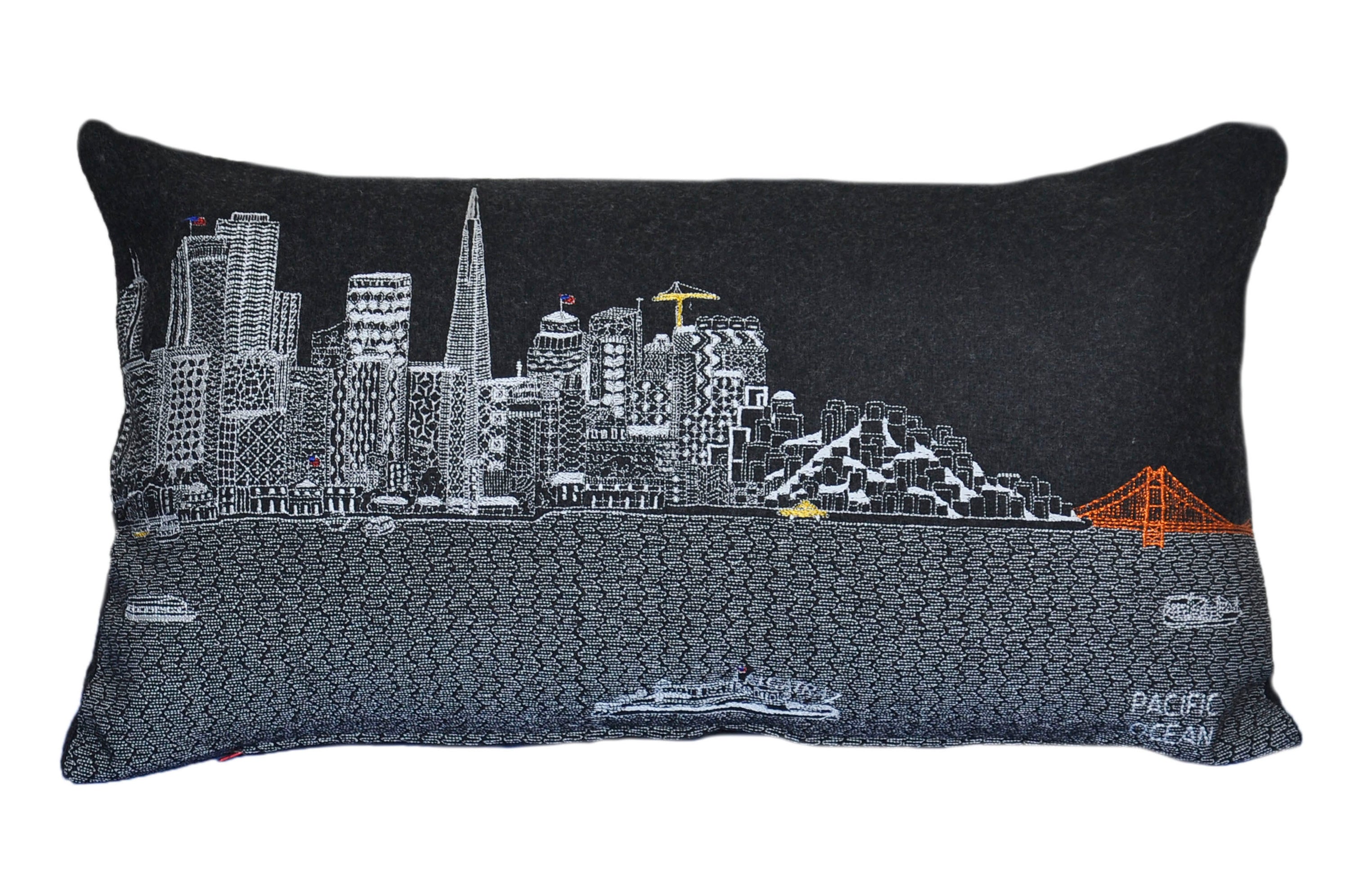 San Francisco Pillow featuring embroidered landmarks like the Golden Gate Bridge and Alcatraz Island, with a red zipper at the bottom.