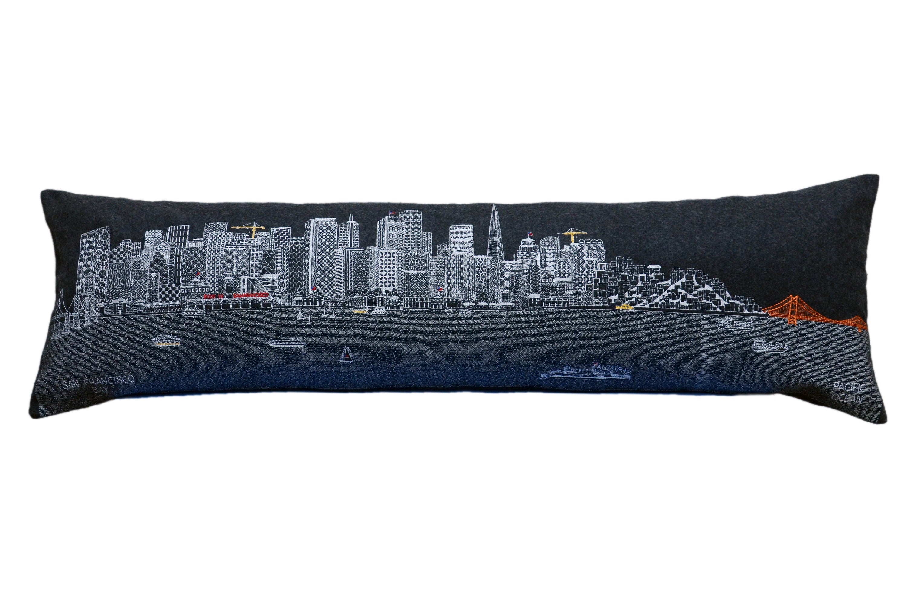 San Francisco Pillow featuring embroidered landmarks like the Golden Gate Bridge and Alcatraz Island, with a red zipper at the bottom.