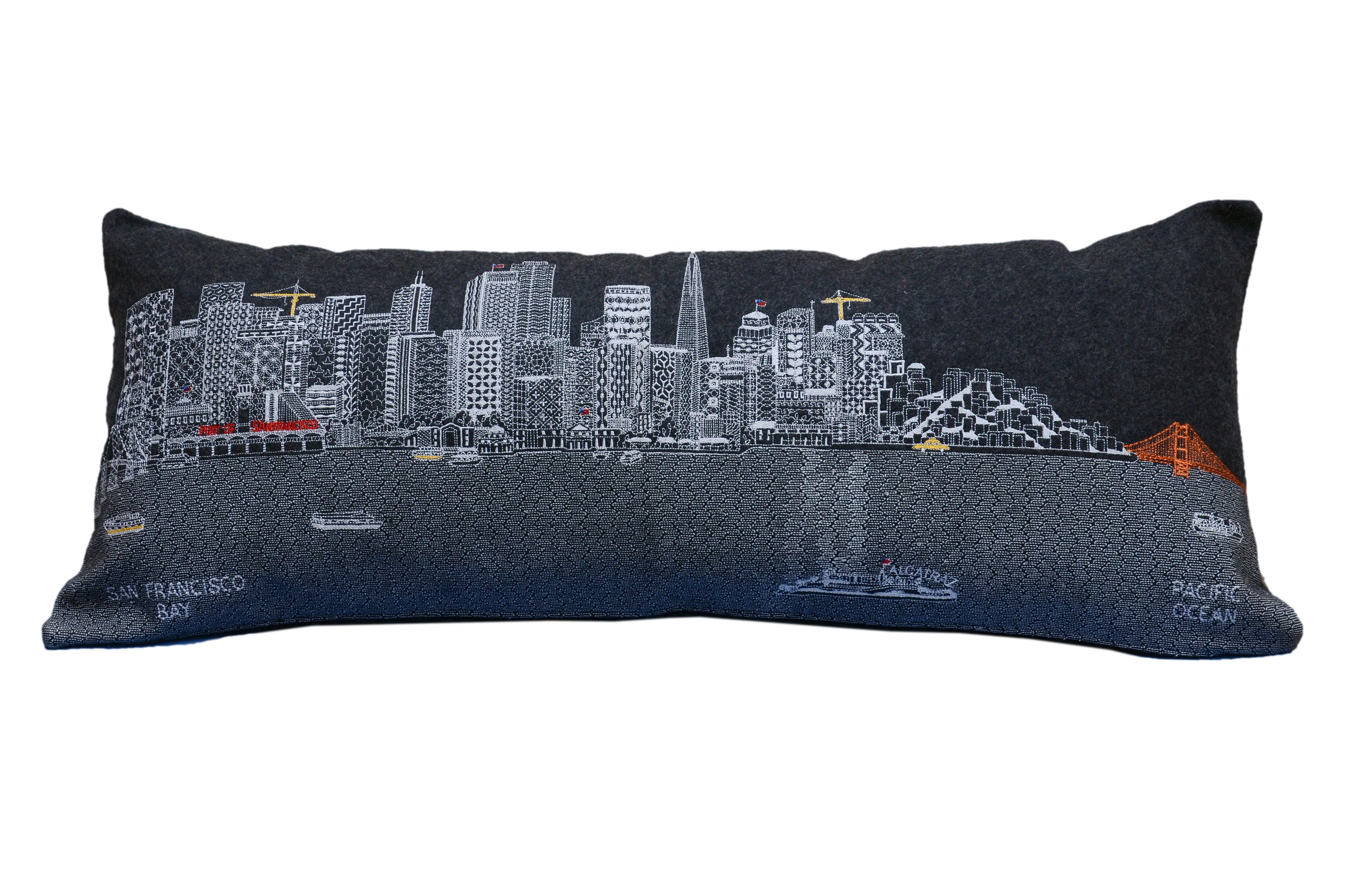 San Francisco Pillow featuring embroidered landmarks like the Golden Gate Bridge and Alcatraz Island, with a red zipper at the bottom.