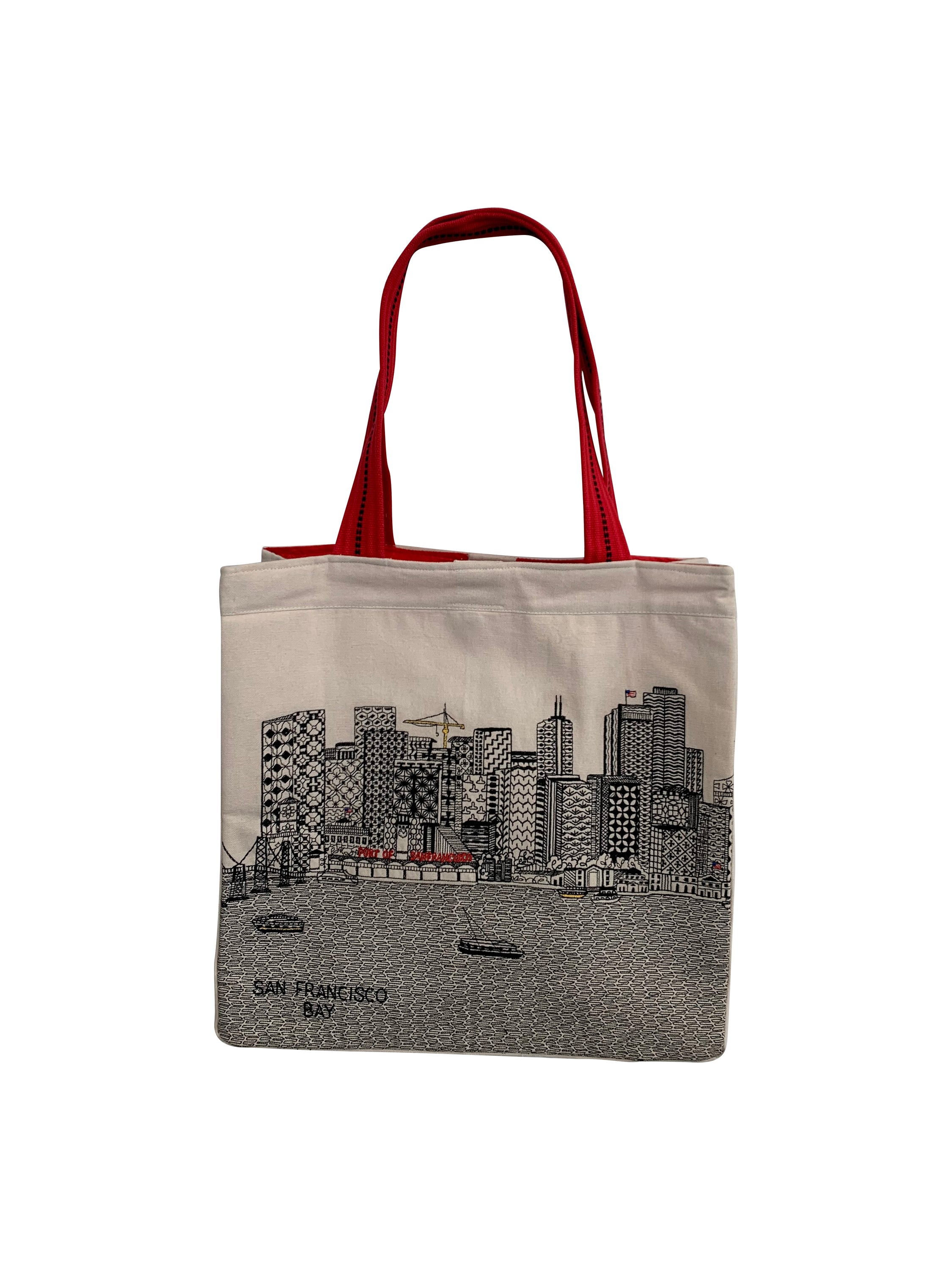 San Francisco Tote Bag featuring an embroidered skyline on cream and black cotton canvas with red waterproof lining and ribbed straps.