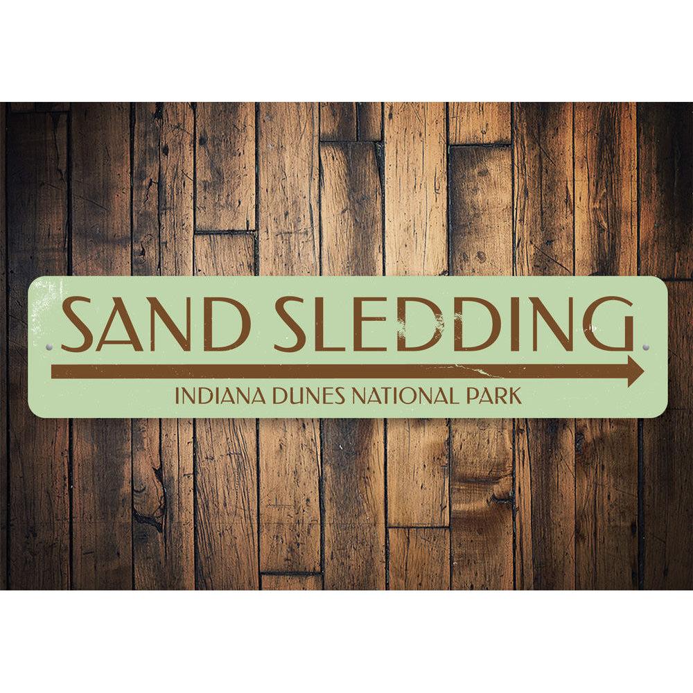 Custom Sand Sledding Sign made of aluminum, featuring vibrant colors and personalized text options, perfect for indoor or outdoor display.