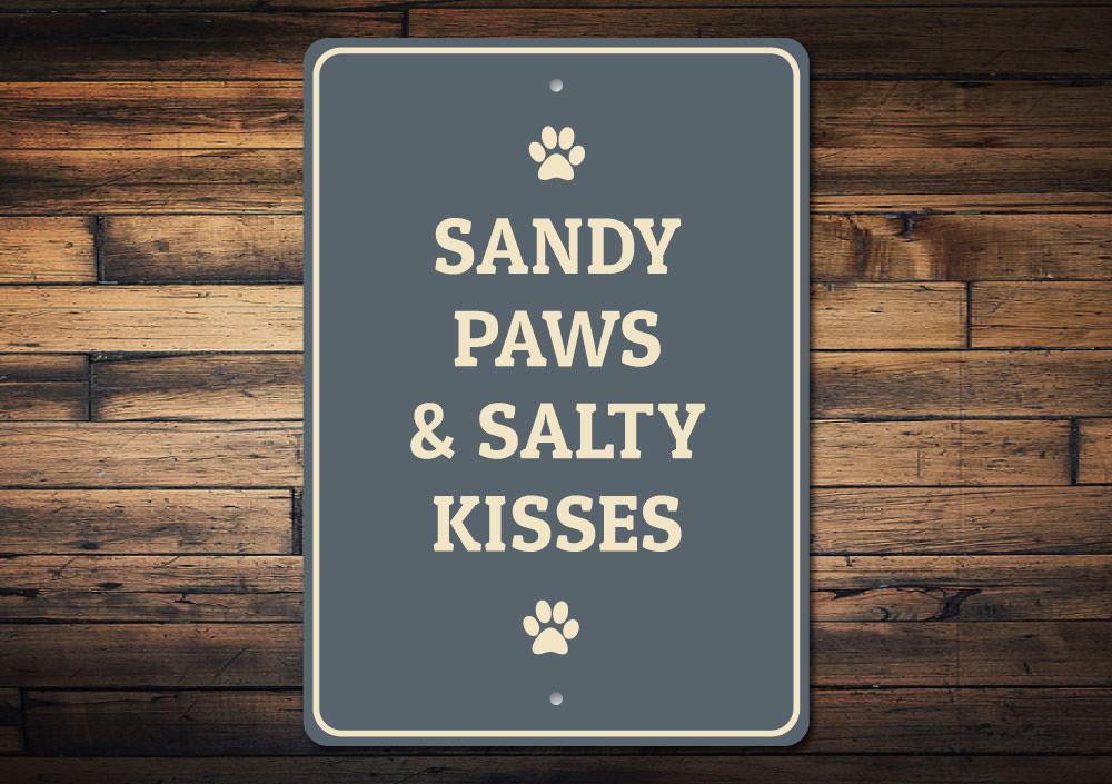 Sandy Paws decorative sign made of aluminum, featuring a playful design perfect for pet lovers, suitable for indoor and outdoor display.