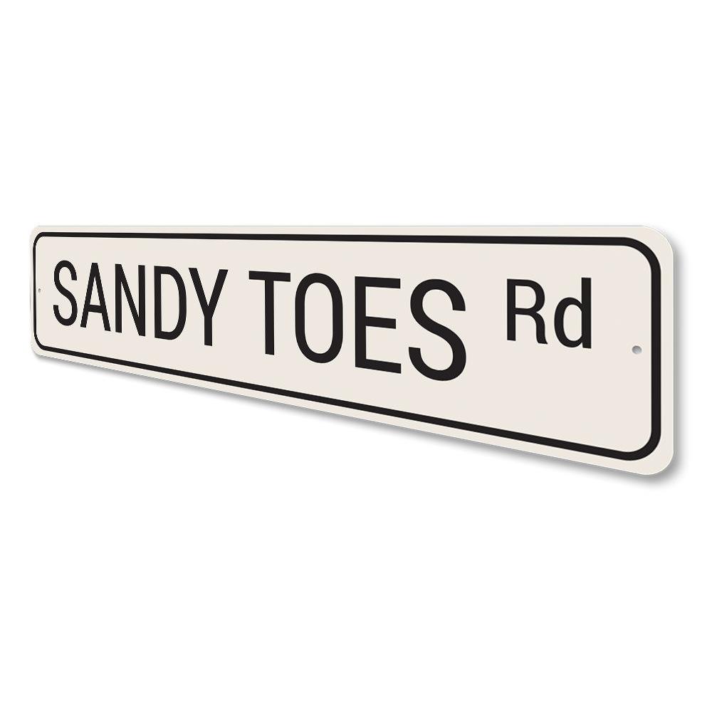 Sandy Toes Road Sign made of high-quality aluminum, featuring vibrant colors and a beach-themed design, perfect for coastal decor.