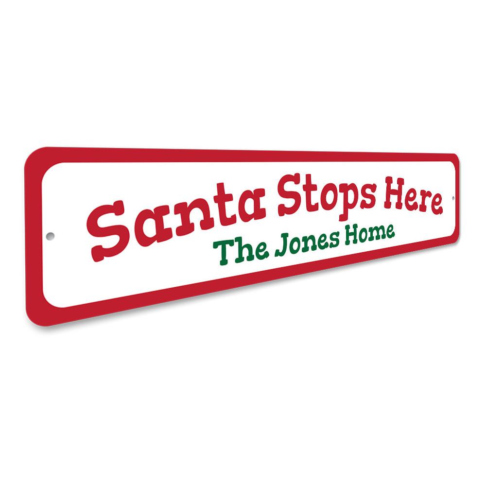 A festive Santa Stop Here Sign made of high-quality aluminum, featuring vibrant colors and a charming design perfect for Christmas decorations.