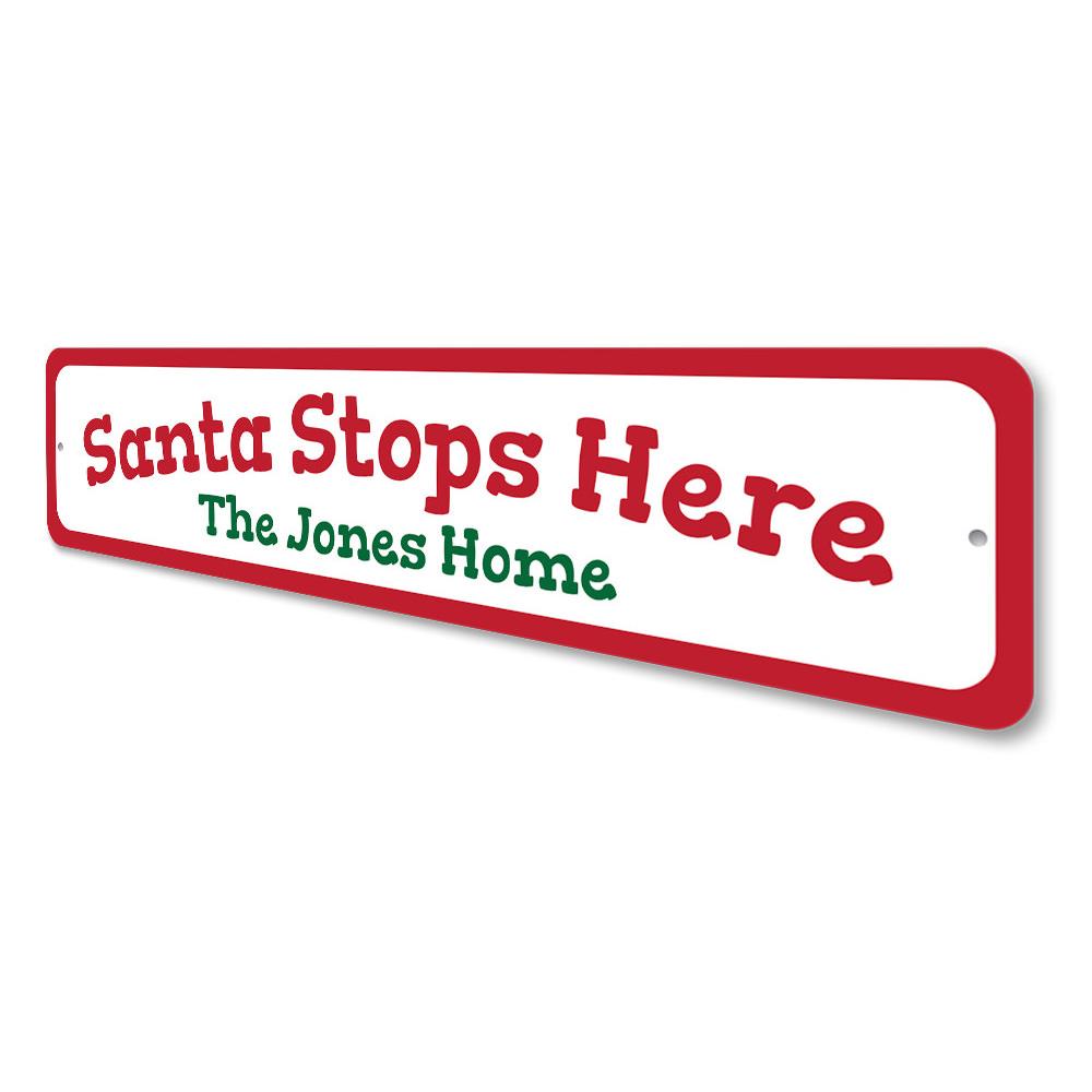 A festive Santa Stop Here Sign made of high-quality aluminum, featuring vibrant colors and a charming design perfect for Christmas decorations.