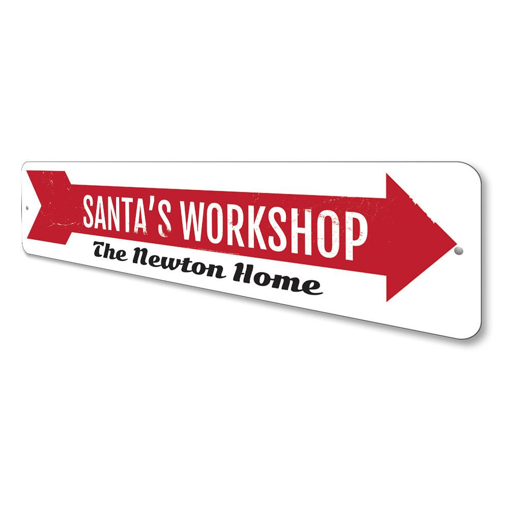 A festive Santa's Workshop Sign made of high-quality aluminum, featuring a charming design perfect for holiday decorations.