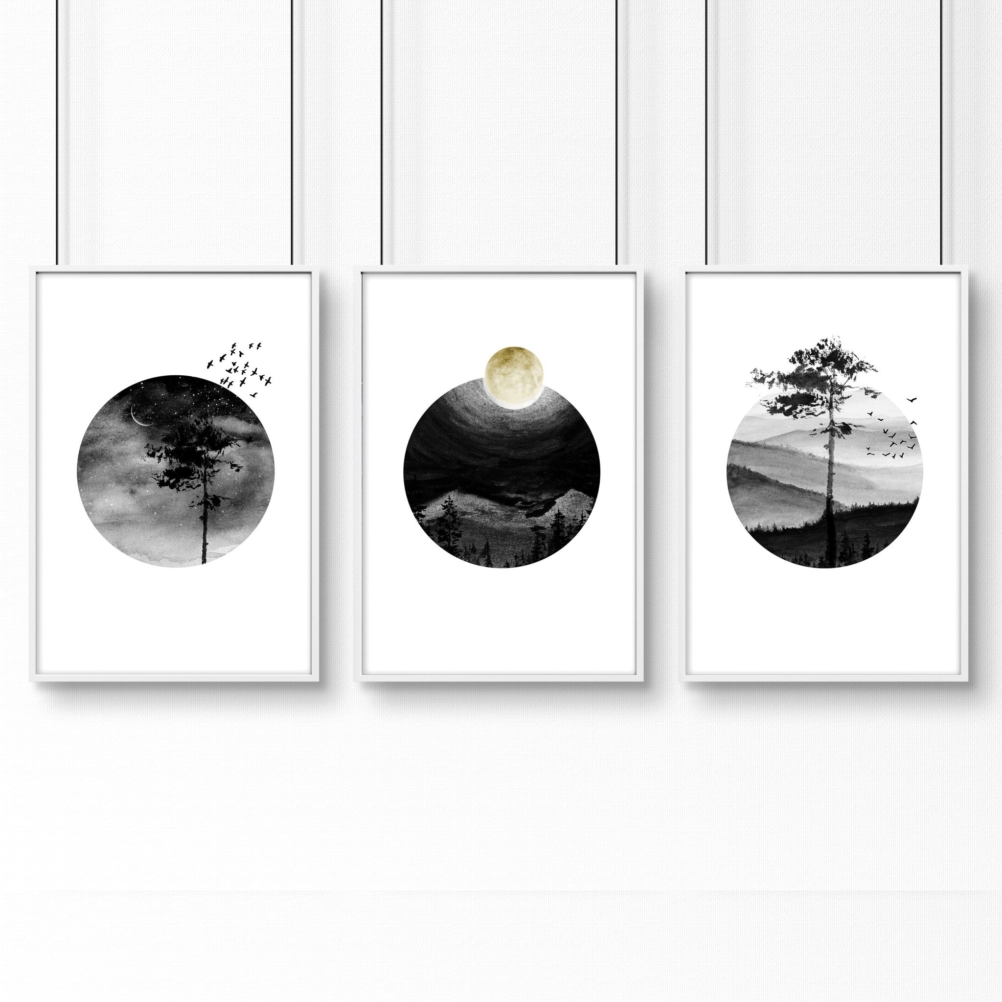 Set of 3 framed Scandi wall art prints featuring greyscale Nordic landscapes in minimal circular designs, perfect for home decor.