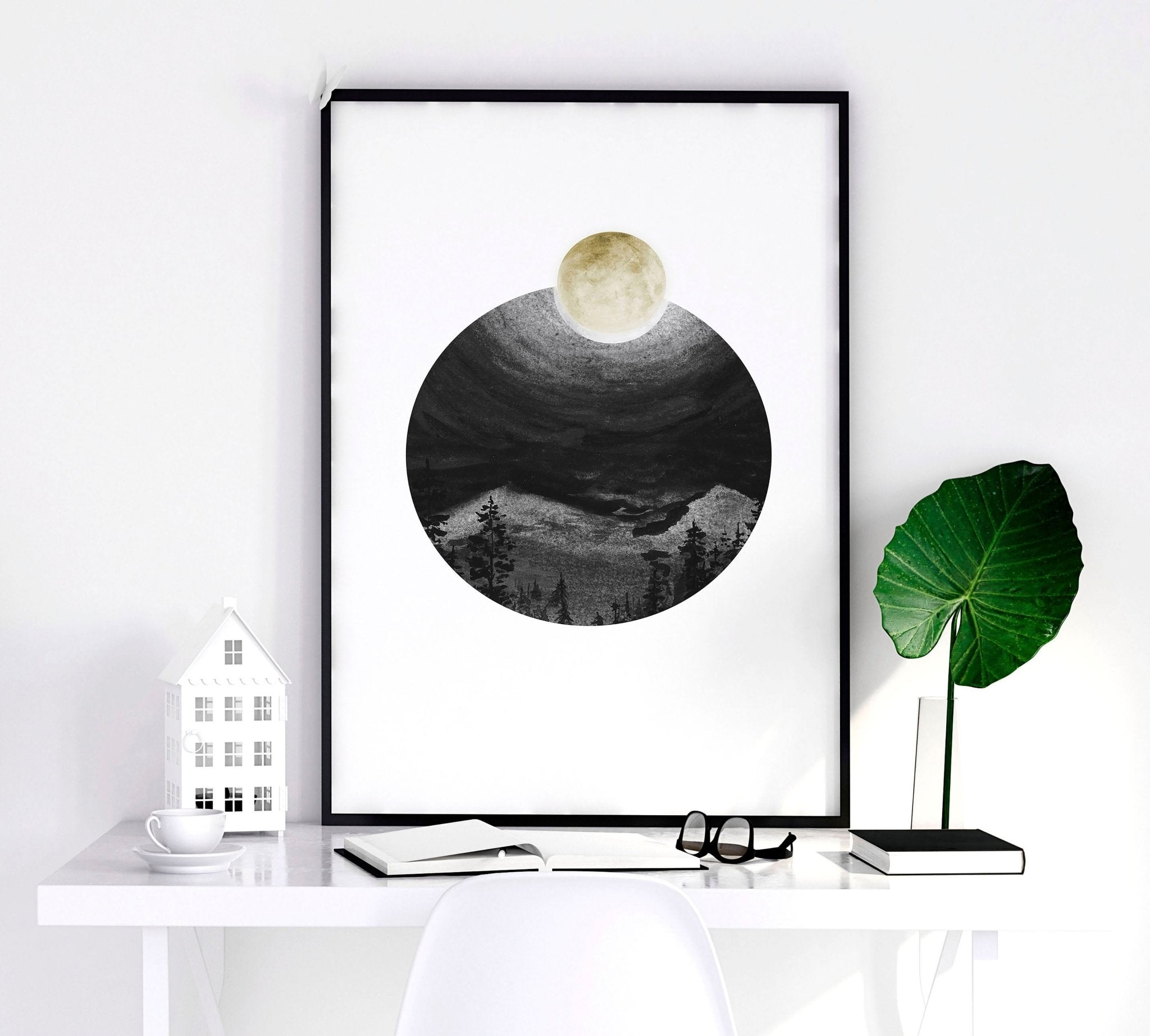 Set of 3 framed Scandi wall art prints featuring greyscale Nordic landscapes in minimal circular designs, perfect for home decor.