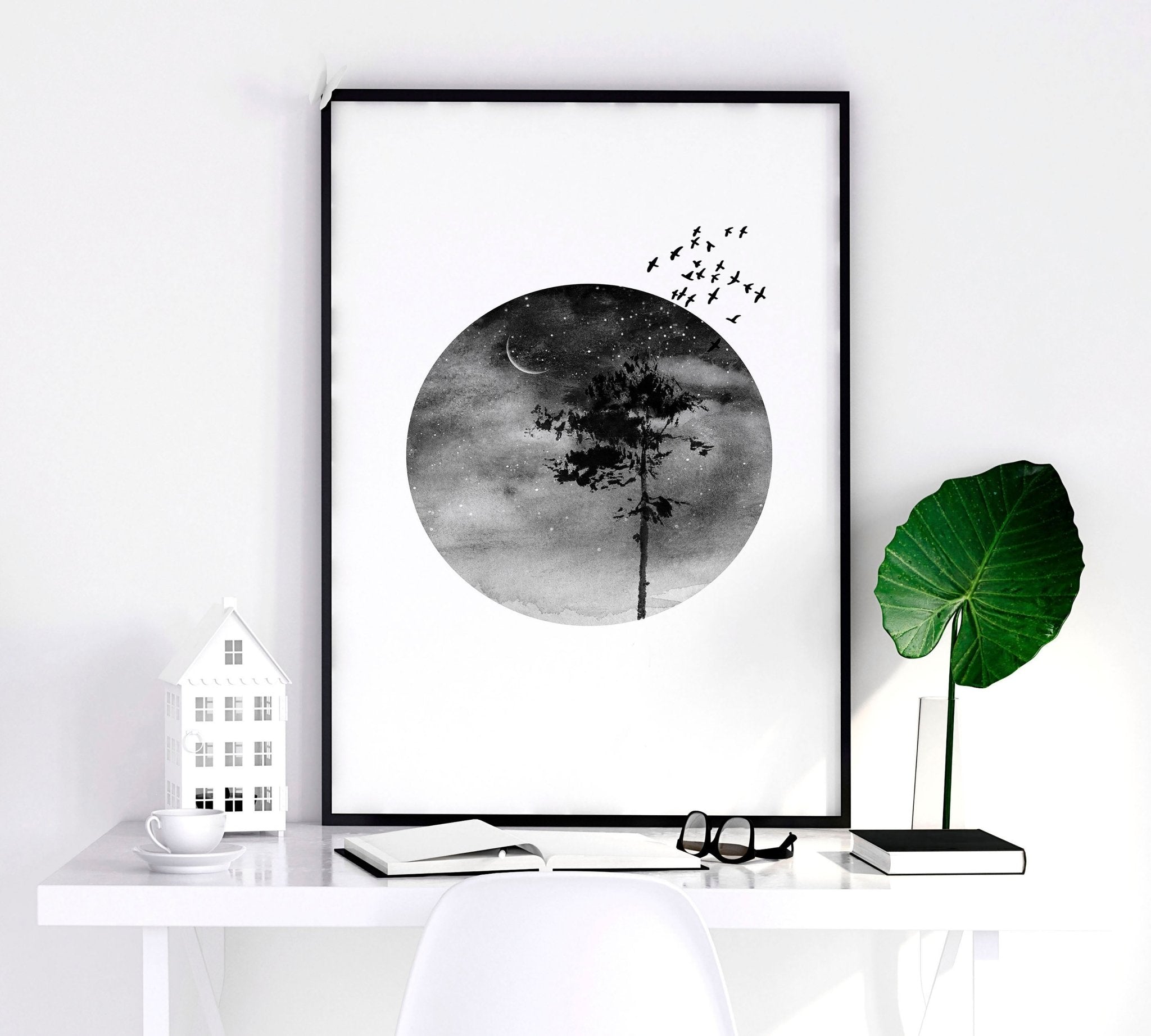 Set of 3 framed Scandi wall art prints featuring greyscale Nordic landscapes in minimal circular designs, perfect for home decor.