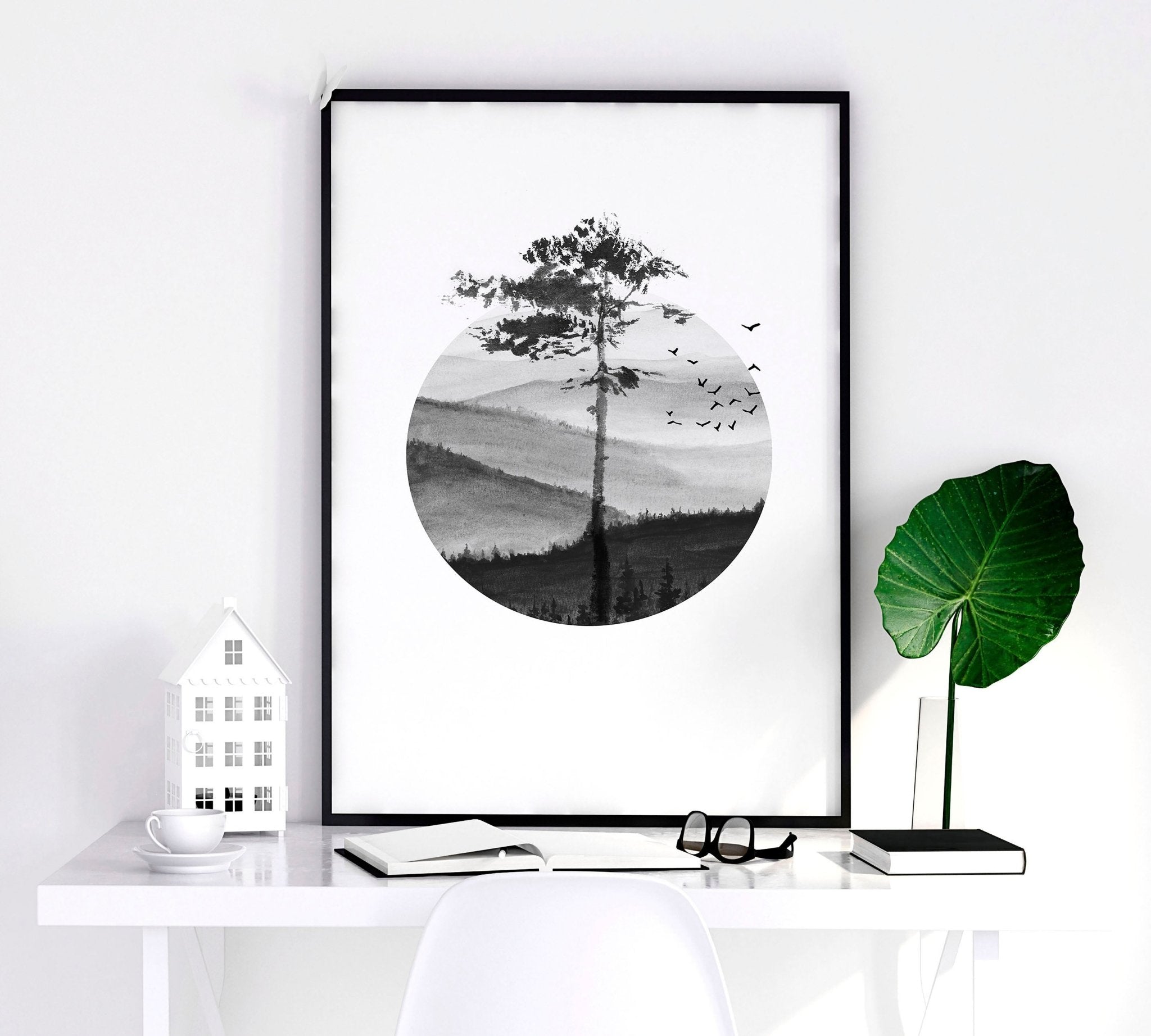 Set of 3 framed Scandi wall art prints featuring greyscale Nordic landscapes in minimal circular designs, perfect for home decor.