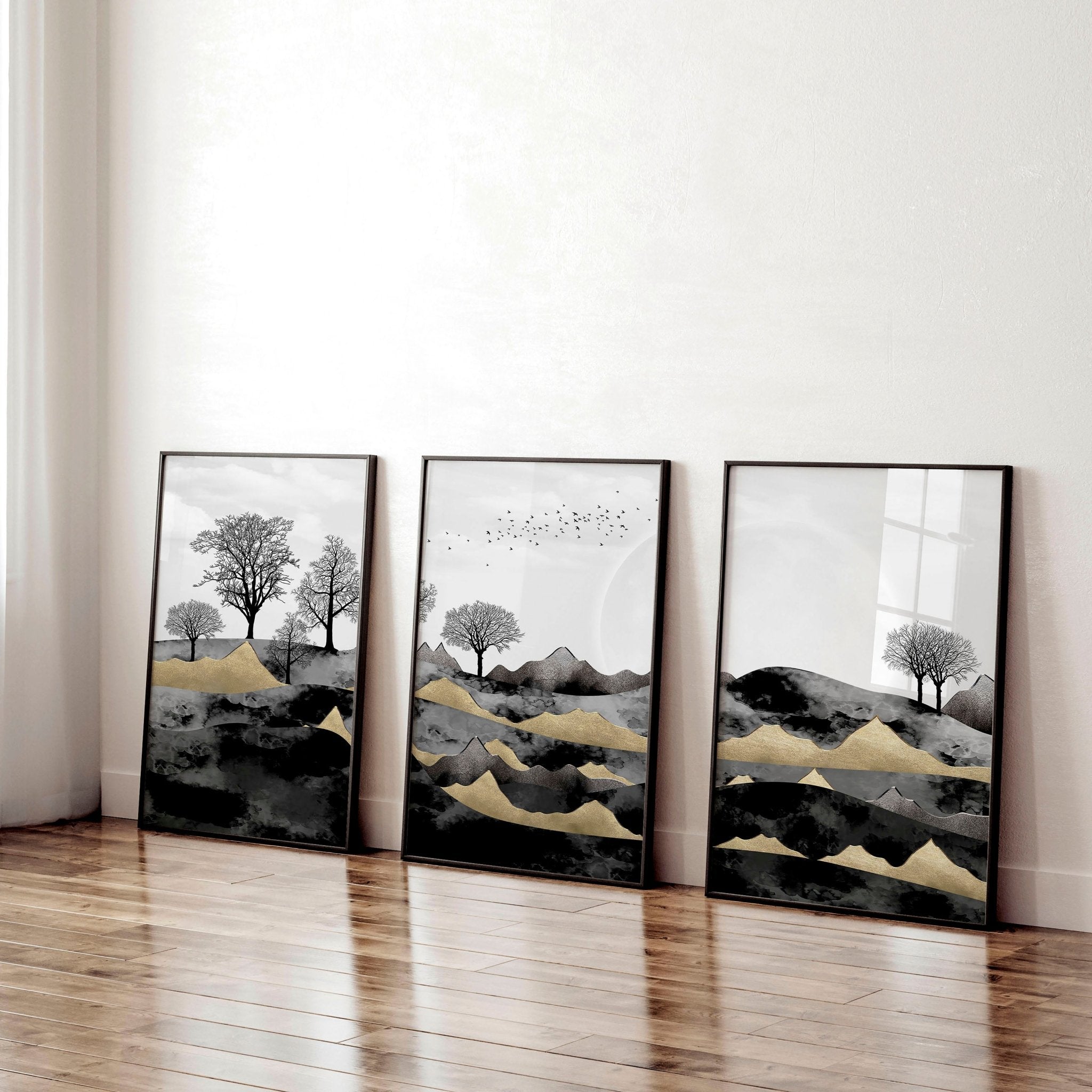 Set of 3 Scandinavian wall art prints featuring a Dark Nordic Forest Landscape, showcasing minimalistic design with black, grey, and gold tones.