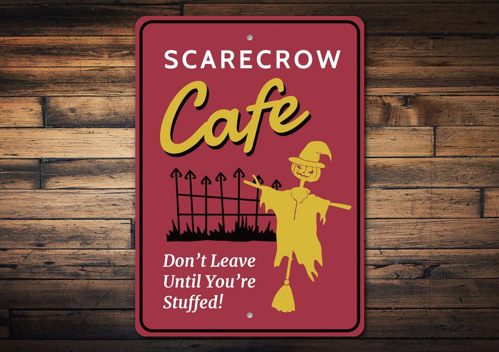 Scarecrow Cafe sign on wood.