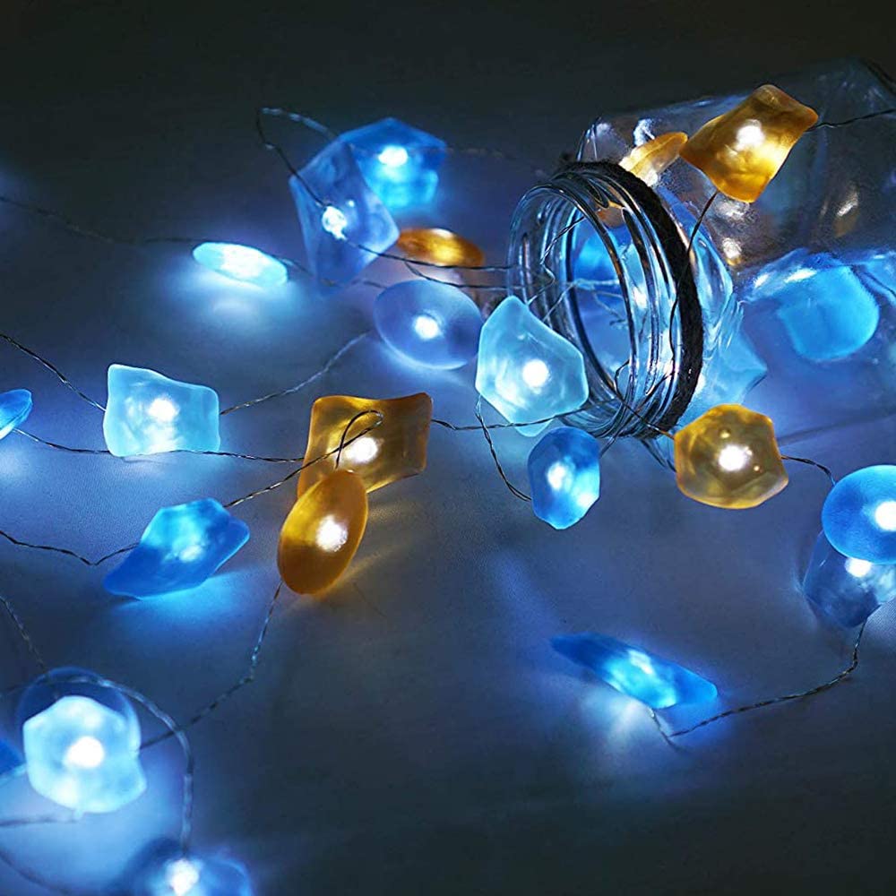 A beautiful display of Sea Glass String Lights with 30 vibrant LEDs on silver wire, showcasing their elegant design and waterproof features.