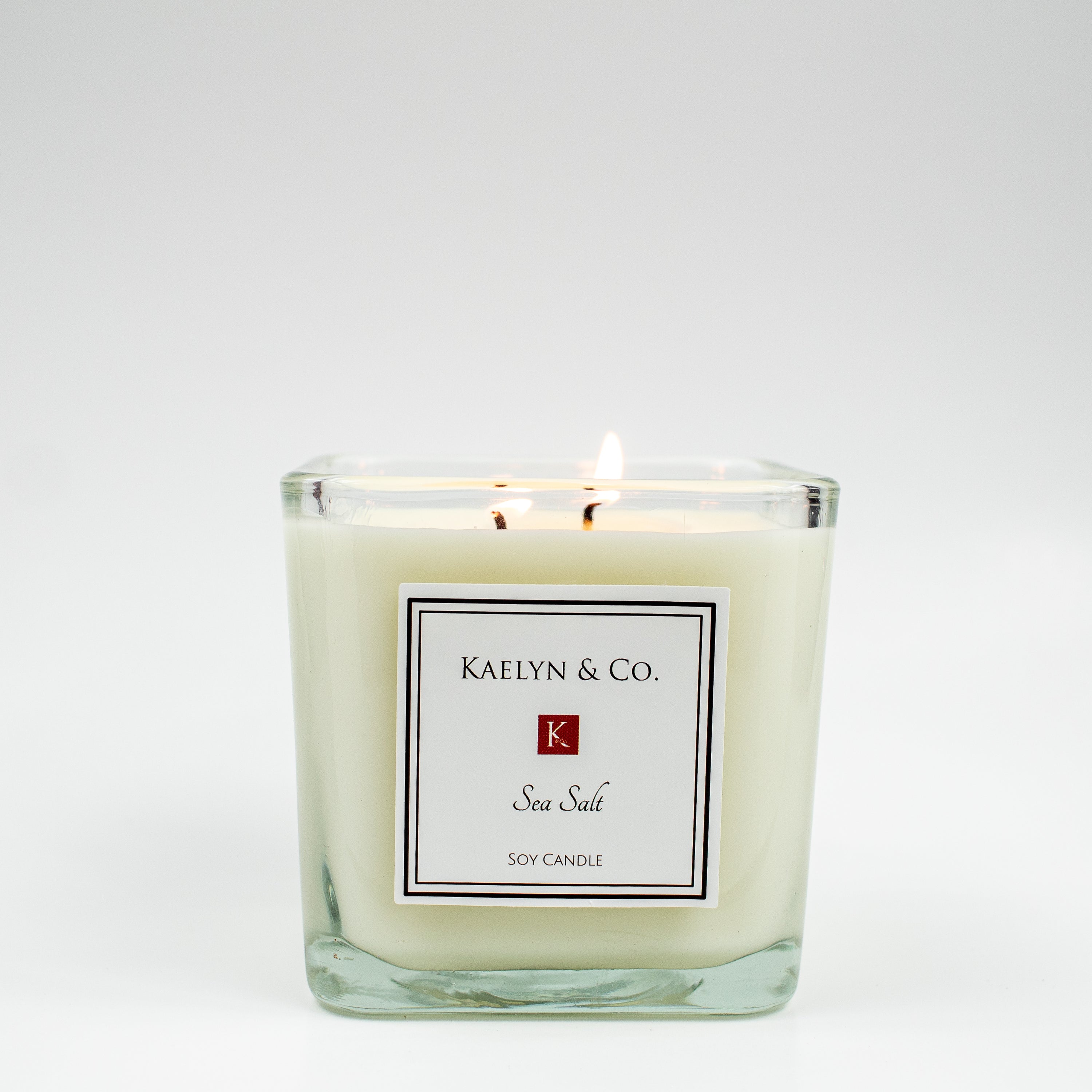 A beautifully crafted Sea Salt Medium Cube Candle in a stylish box, showcasing its elegant design and natural soy wax.