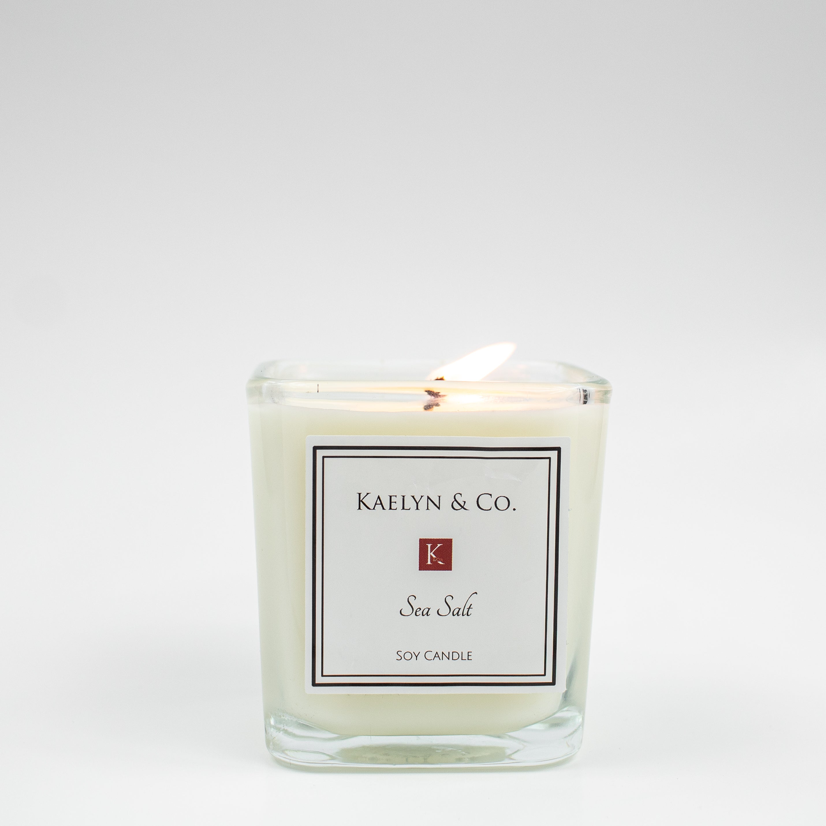 A beautifully crafted Sea Salt Small Cube Candle in a minimalist design, showcasing its soft floral and sea salt notes.