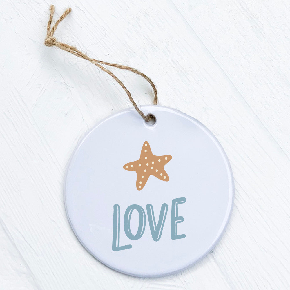 A beautifully crafted Sea Star Love Ornament made of high-quality porcelain, featuring a vibrant design and a smooth glossy finish.