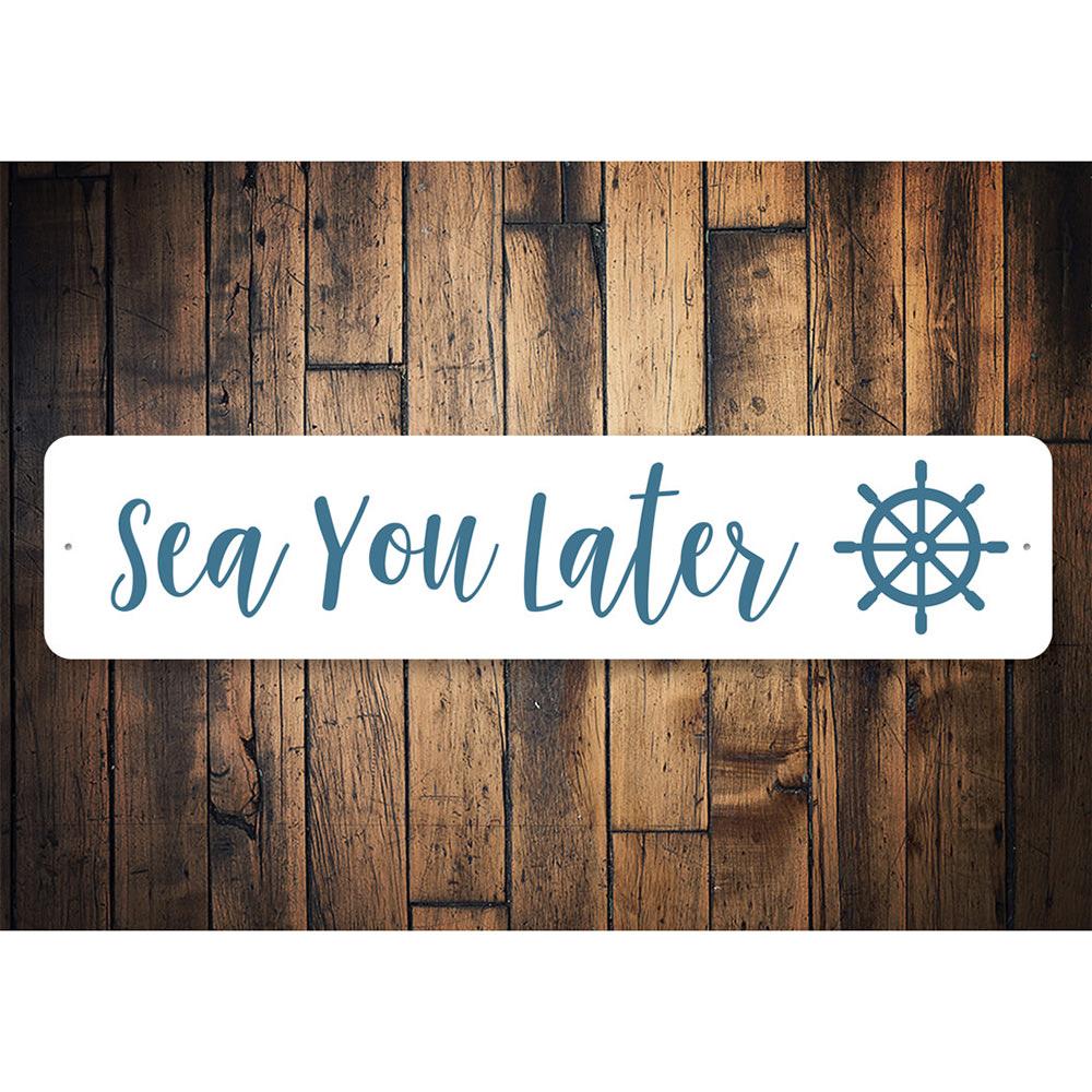 A decorative Sea You Later Sign made of durable aluminum, featuring a beach-themed design perfect for coastal decor.