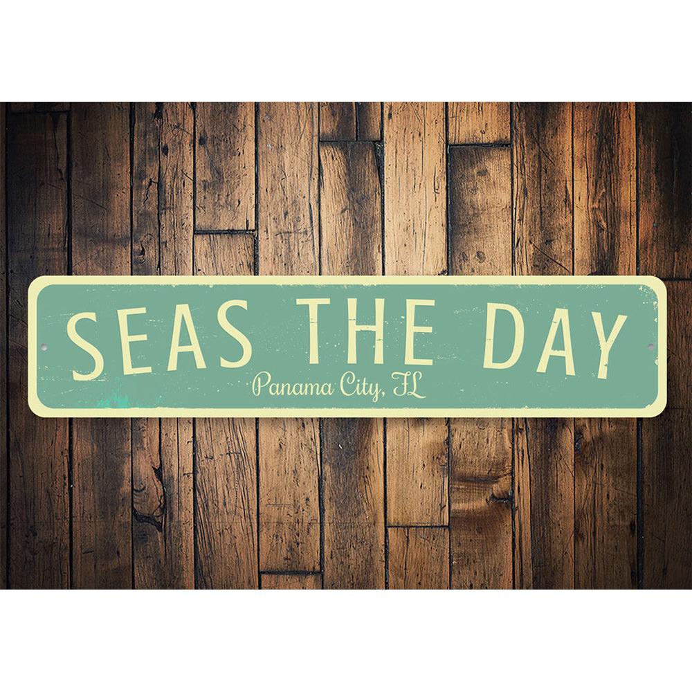 Seas The Day Location Sign featuring vibrant coastal design, made of durable aluminum, perfect for beach-themed decor.