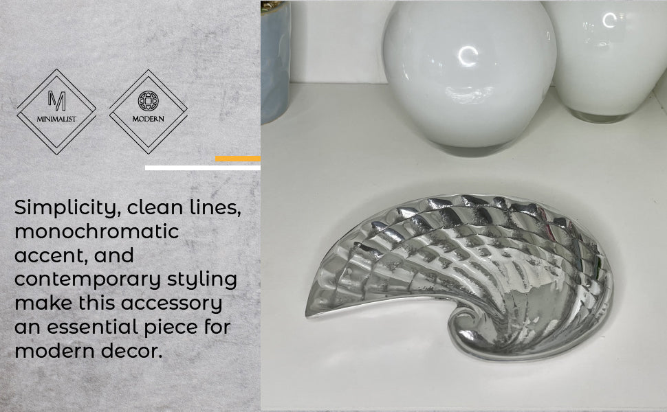 A beautifully crafted seashell-shaped soap dish made from recycled aluminum, showcasing a chic finish and minimalist design.