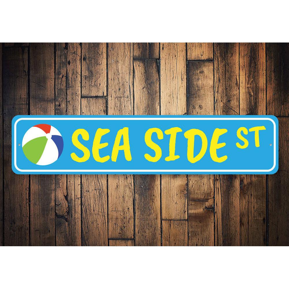 A decorative Seaside Street Sign made of high-quality aluminum, featuring vibrant colors and customizable text, perfect for beach-themed decor.