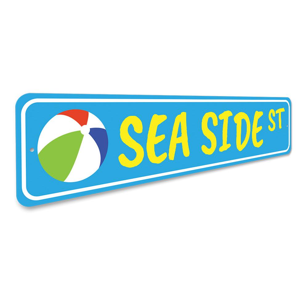 A decorative Seaside Street Sign made of high-quality aluminum, featuring vibrant colors and customizable text, perfect for beach-themed decor.