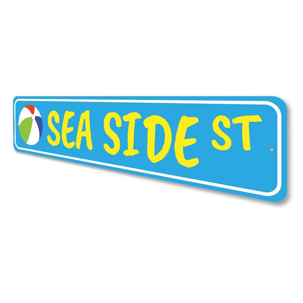 A decorative Seaside Street Sign made of high-quality aluminum, featuring vibrant colors and customizable text, perfect for beach-themed decor.