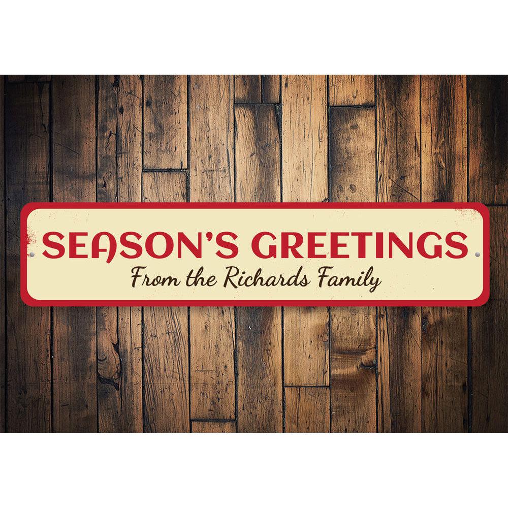 A festive Season's Greetings Family Name Sign made of high-quality aluminum, featuring customizable text for a personal touch, perfect for holiday decor.