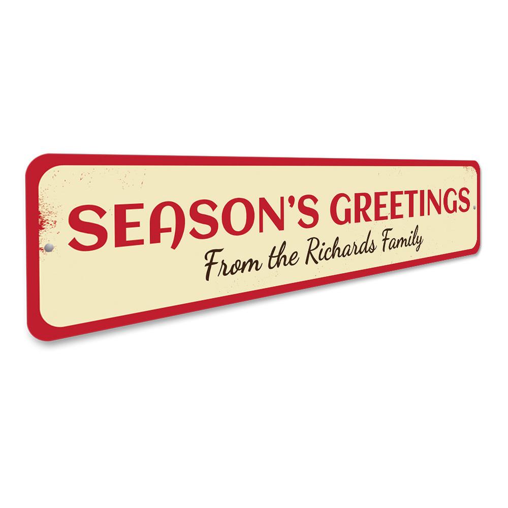 A festive Season's Greetings Family Name Sign made of high-quality aluminum, featuring customizable text for a personal touch, perfect for holiday decor.