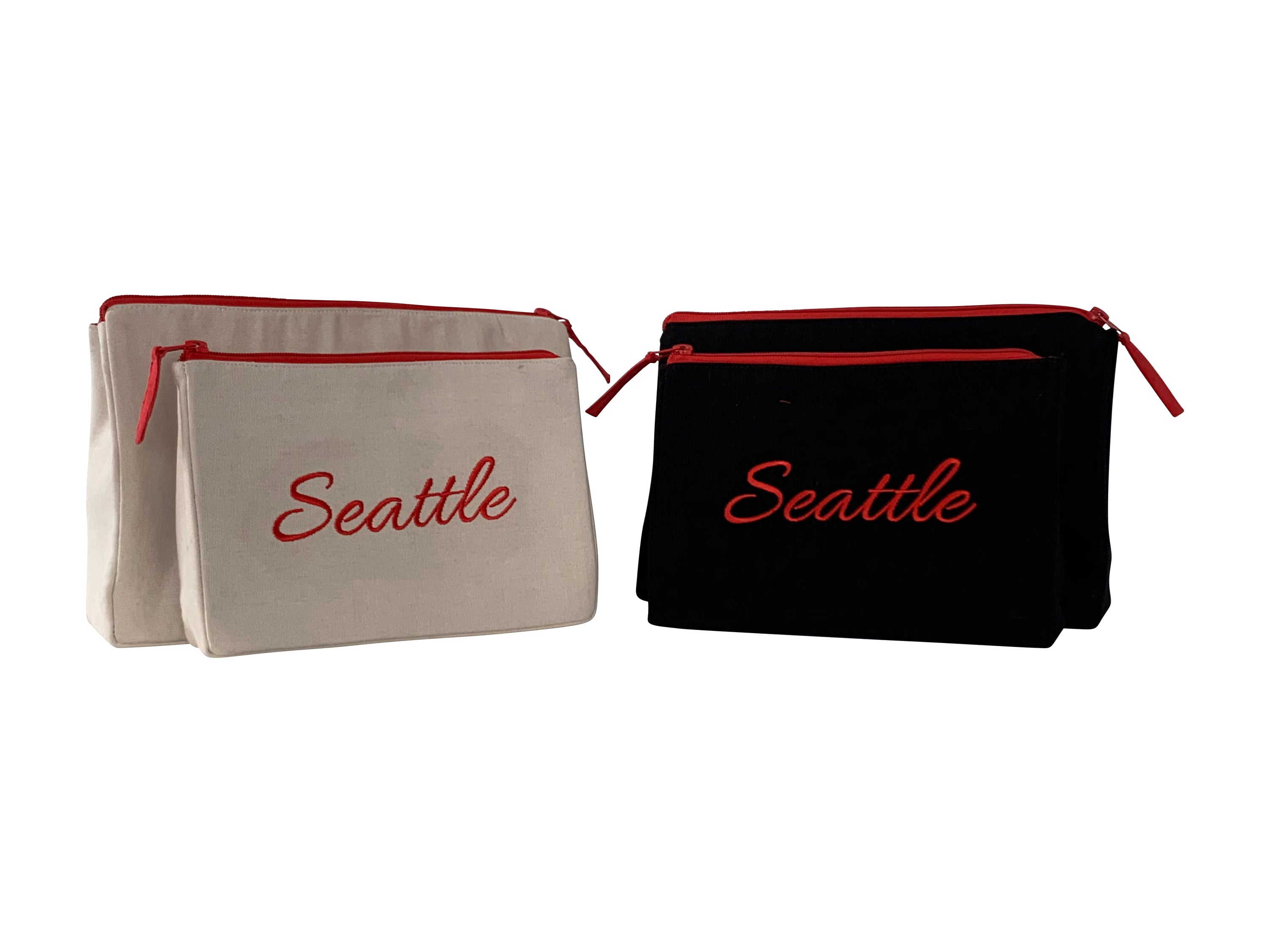 Seattle Makeup Bag set featuring embroidered skyline on cream and black cotton canvas with red waterproof lining.