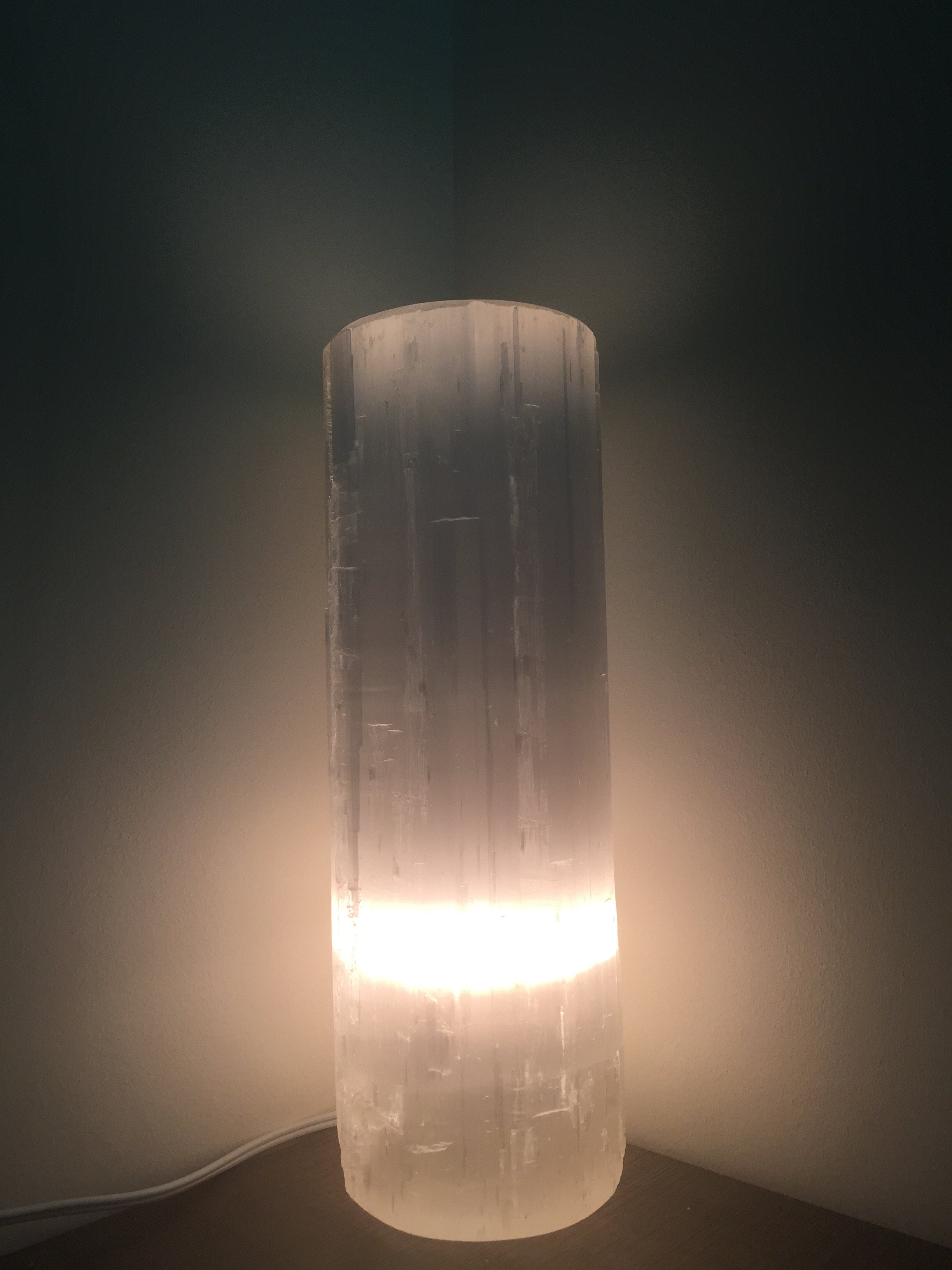 A Selenite Crystal Flat Top Lamp, showcasing its natural crystal structure and soft glow, perfect for meditation and home decor.