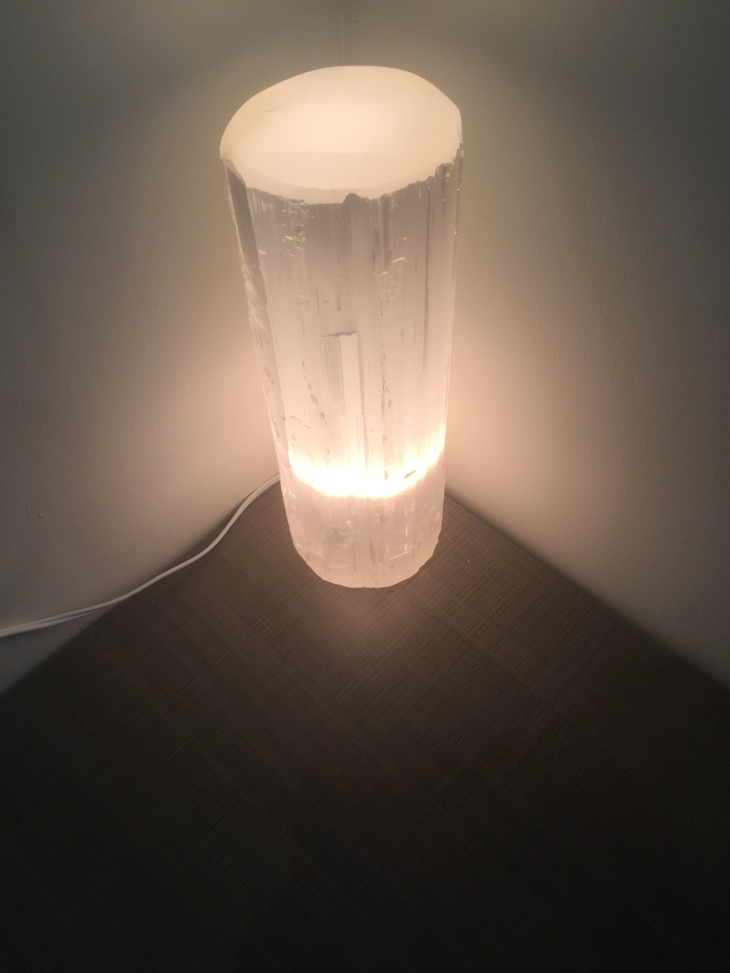 A Selenite Crystal Flat Top Lamp, showcasing its natural crystal structure and soft glow, perfect for meditation and home decor.