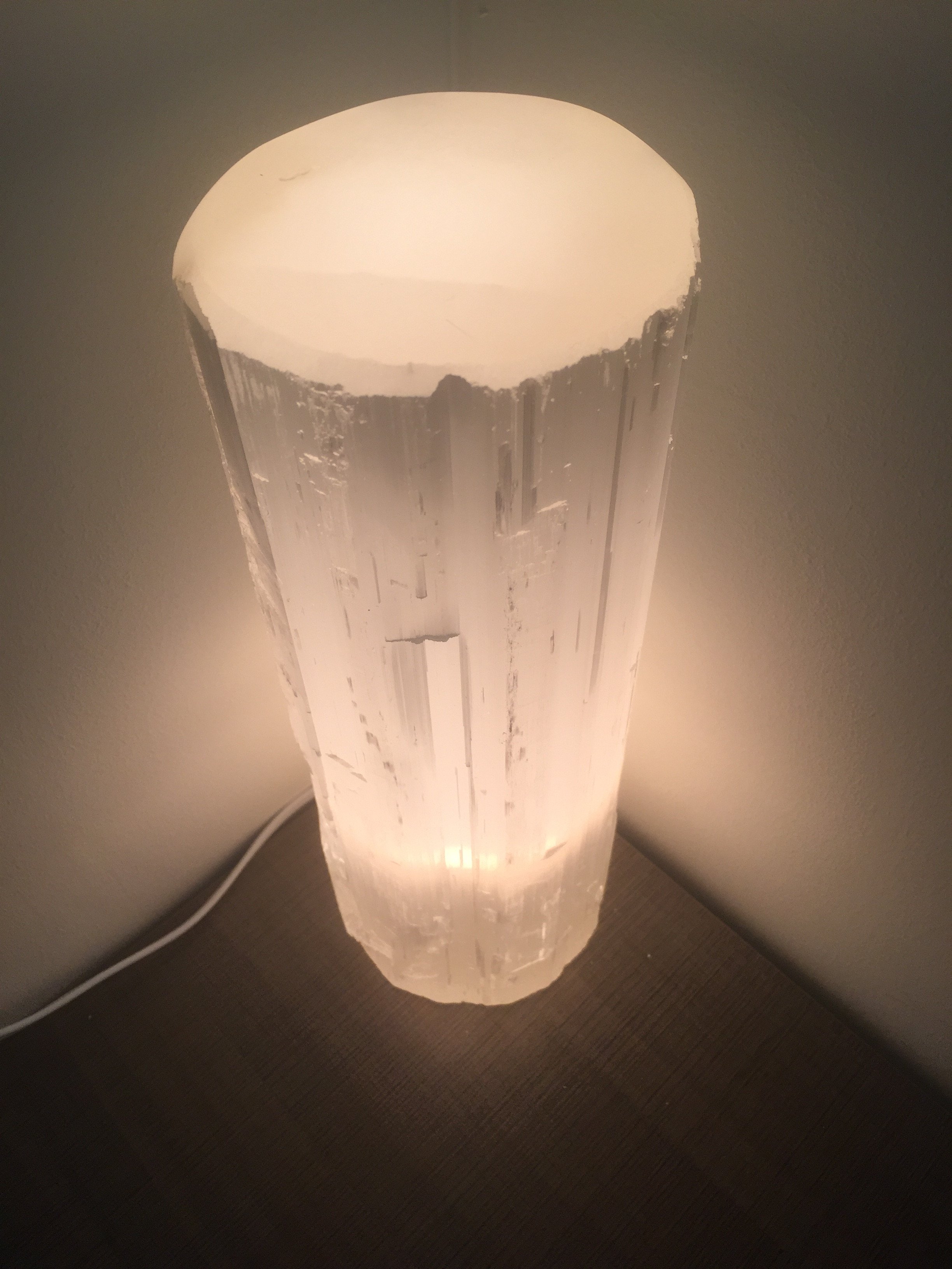 A Selenite Crystal Flat Top Lamp, showcasing its natural crystal structure and soft glow, perfect for meditation and home decor.