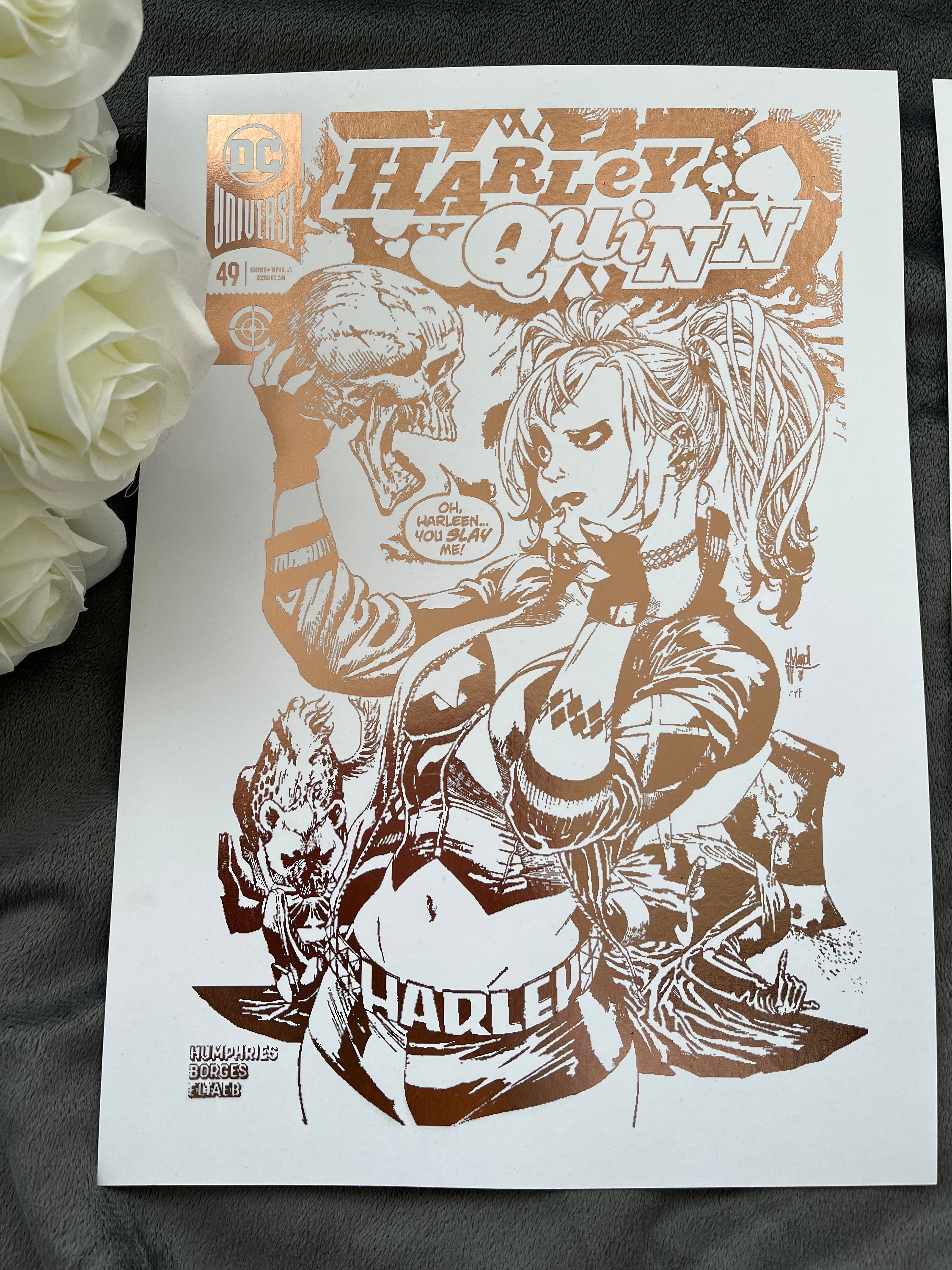 Set of 2 Harley Quinn foil prints featuring rose gold accents, showcasing a comic cover and an action-packed comic strip.